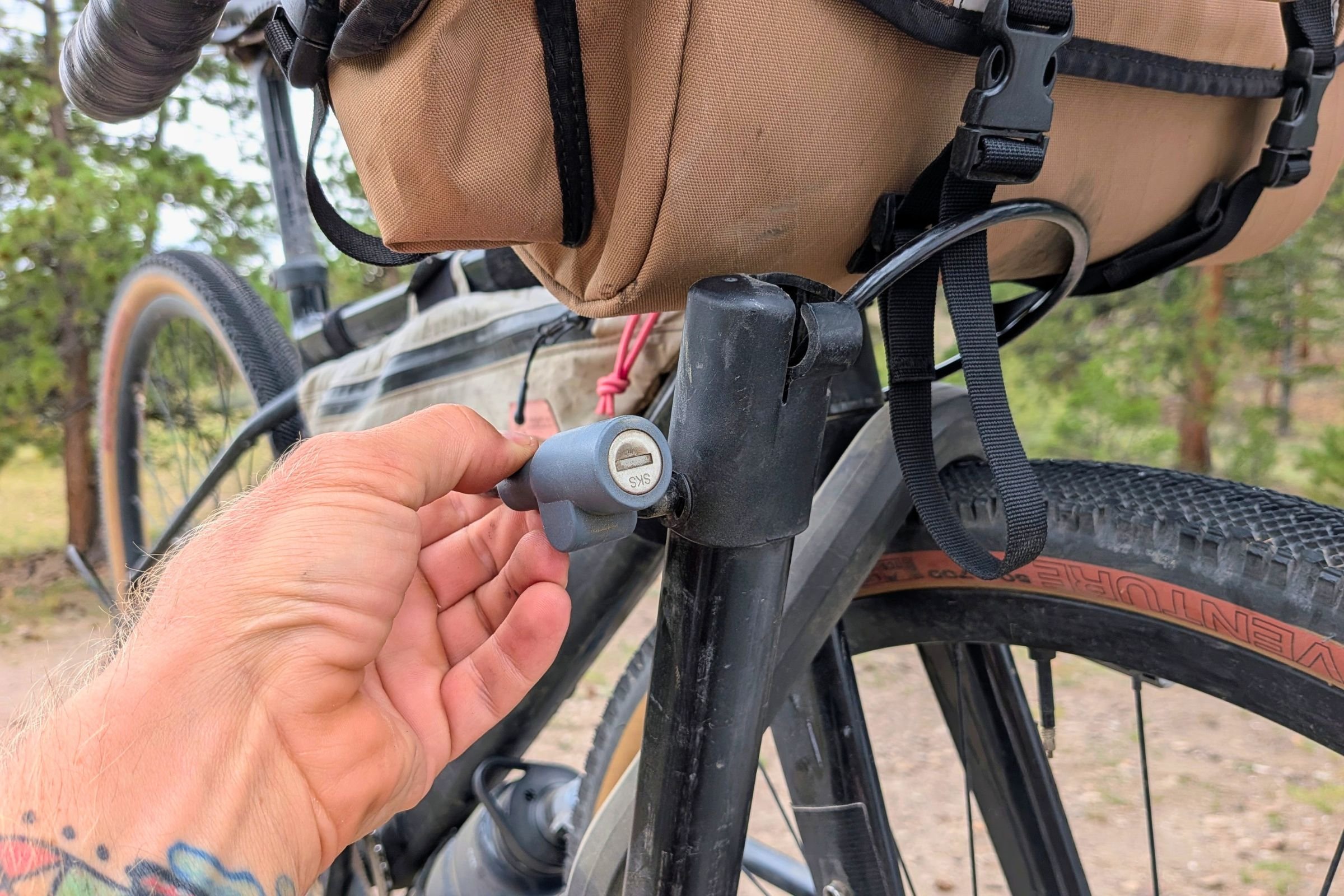 Handling a bicycle mounted on a Yakima EXO DoubleUp 2-Bike Hitch Rack.