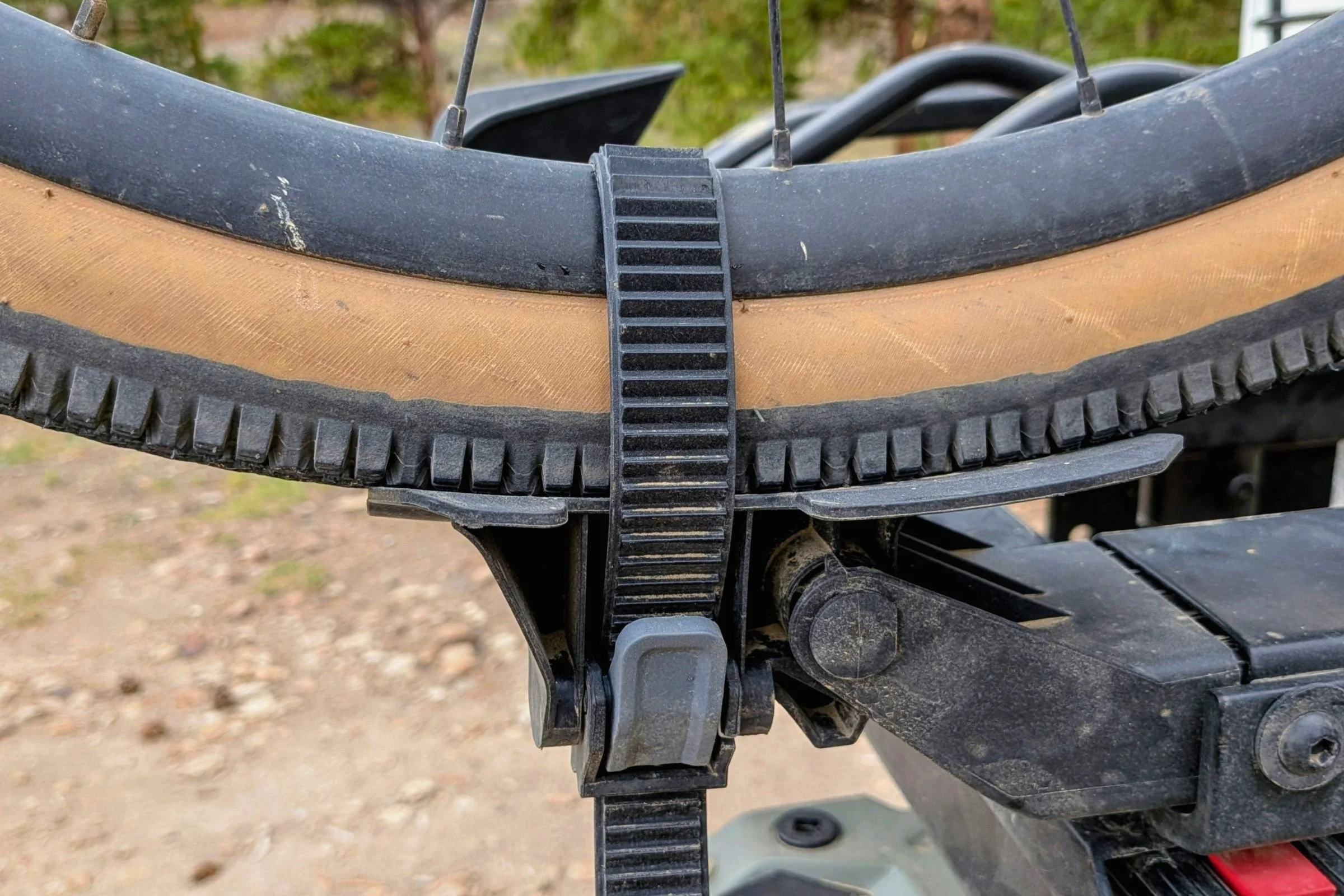Close-up of a bicycle tire secured to a Yakima EXO DoubleUp 2-Bike Hitch Rack.
