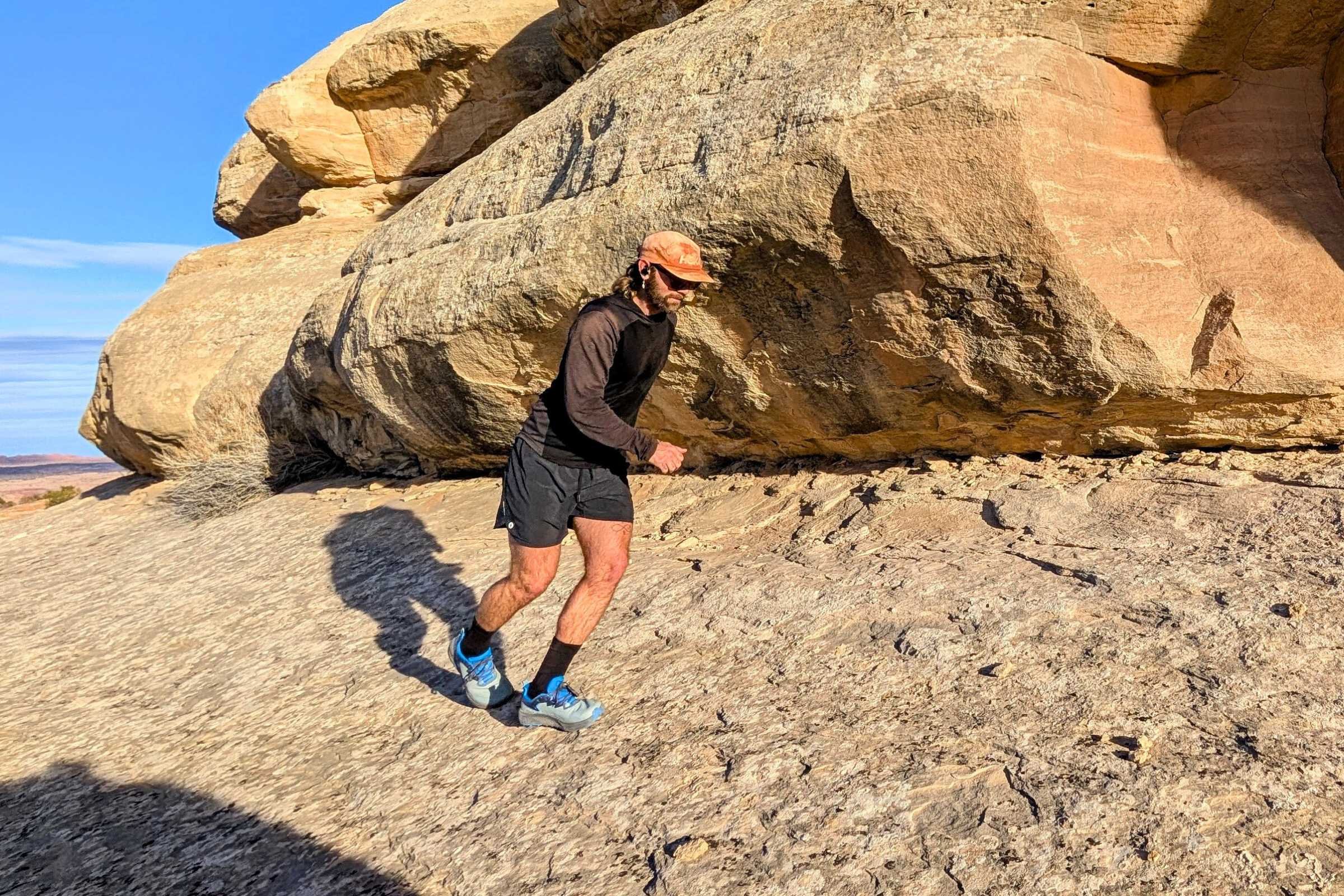 Running across smooth sandstone in the Altra Timp 6s.