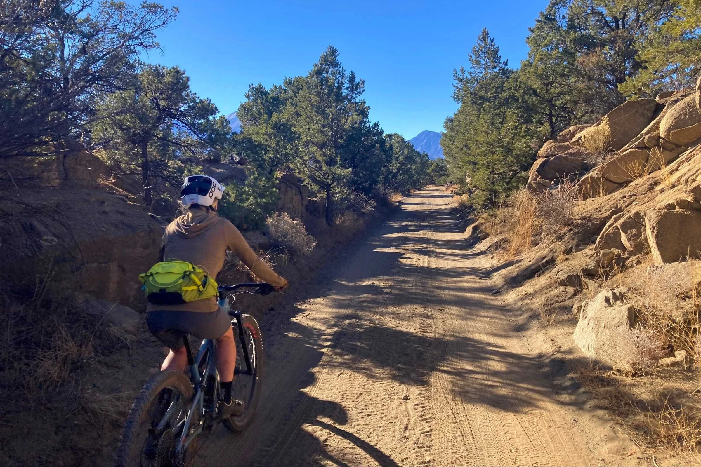 Hip packs allow riders to store gear, water, and food while distributing weight to interfere less with balance and mobility. Here, the author is testing the Evoc Hip Pack.