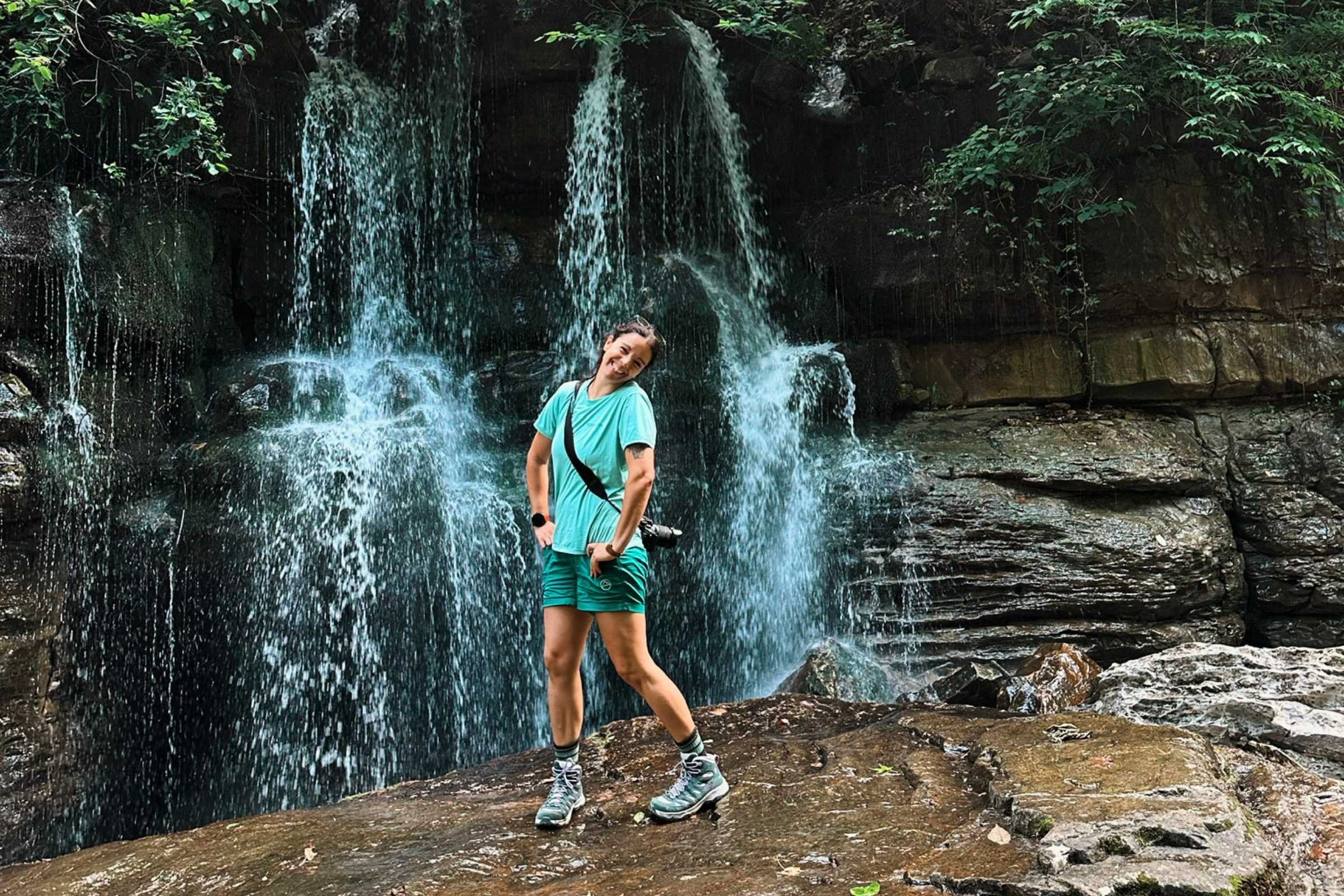 Oboz Sawtooth Ascent Mid Hiking Boots on slippery rocks at a waterfall
