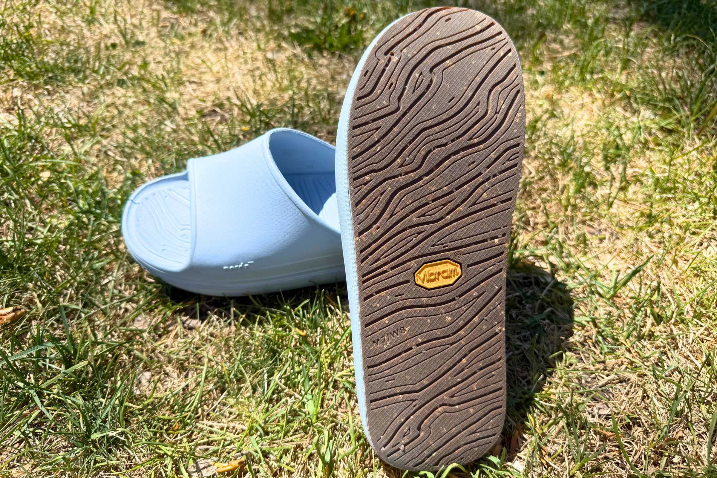 Norda 008 Recovery Slides: A pair of blue slides on the grass.