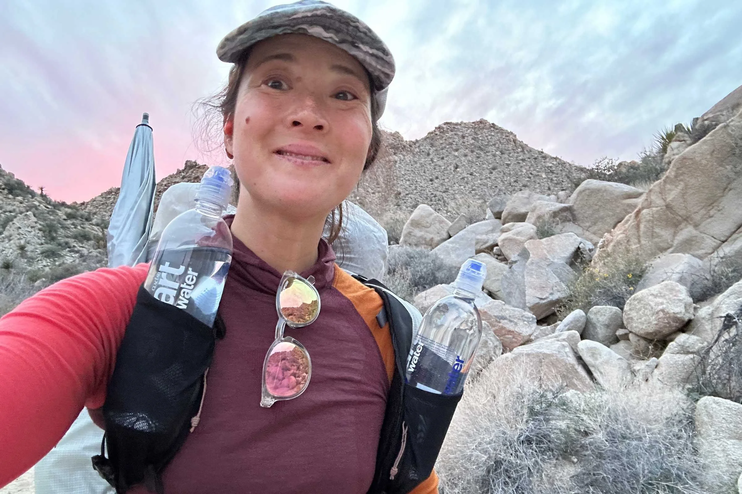 close-up of the mountain hardwear alakazam strap pockets in use while the author backpacks