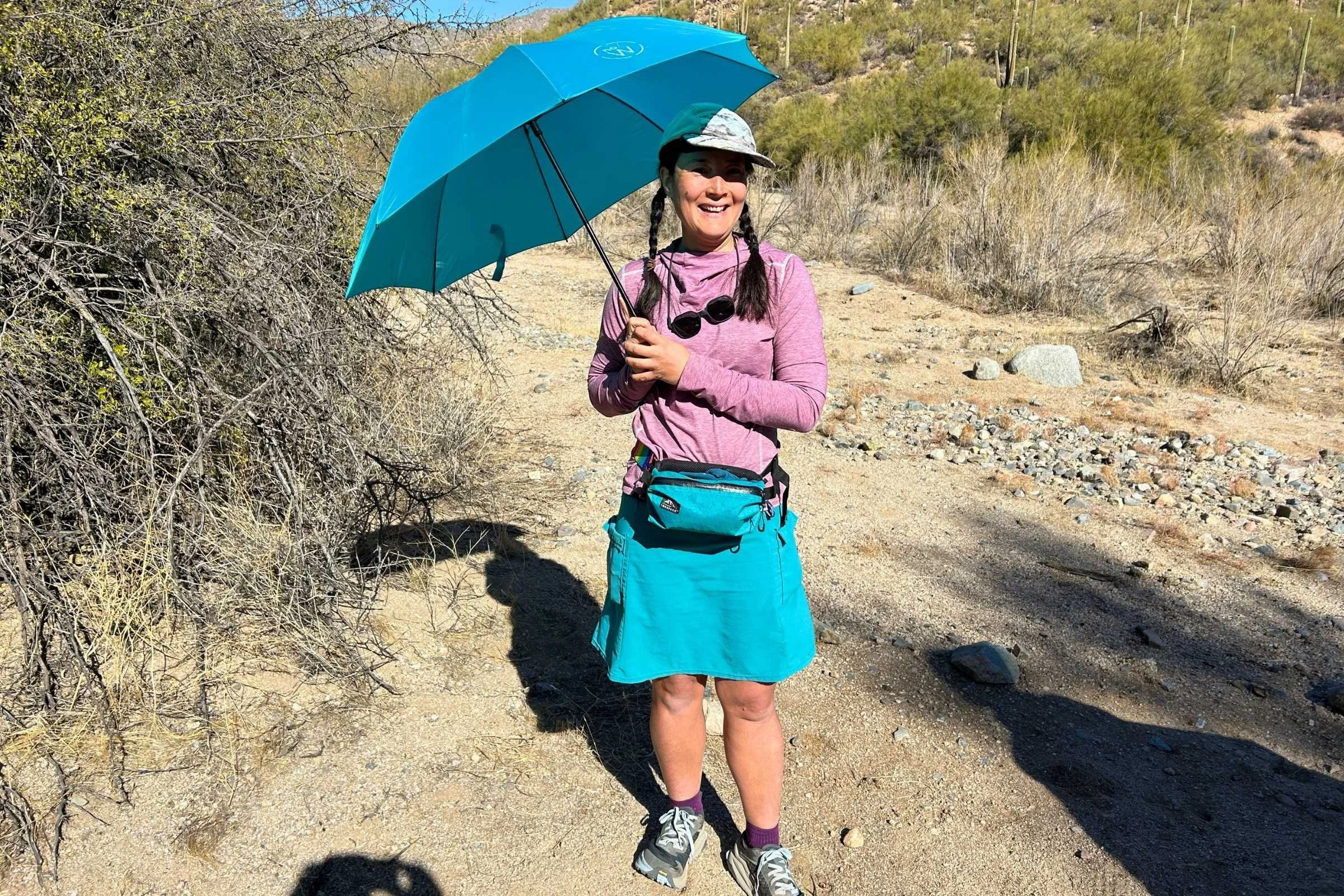 Liz Thomas hiking with a hiking umbrella