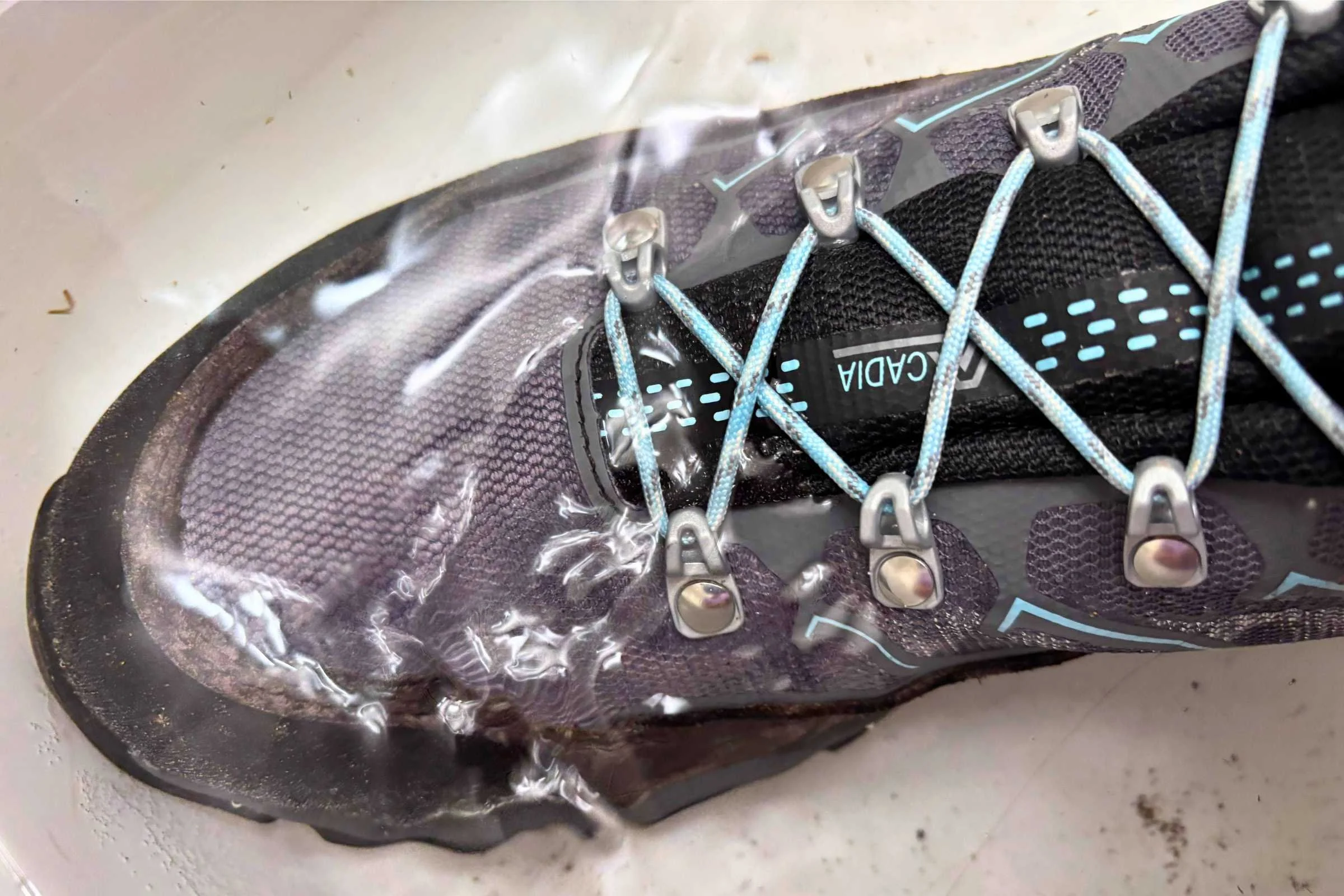 the Asolo Acadia boots submerged in a tub of water