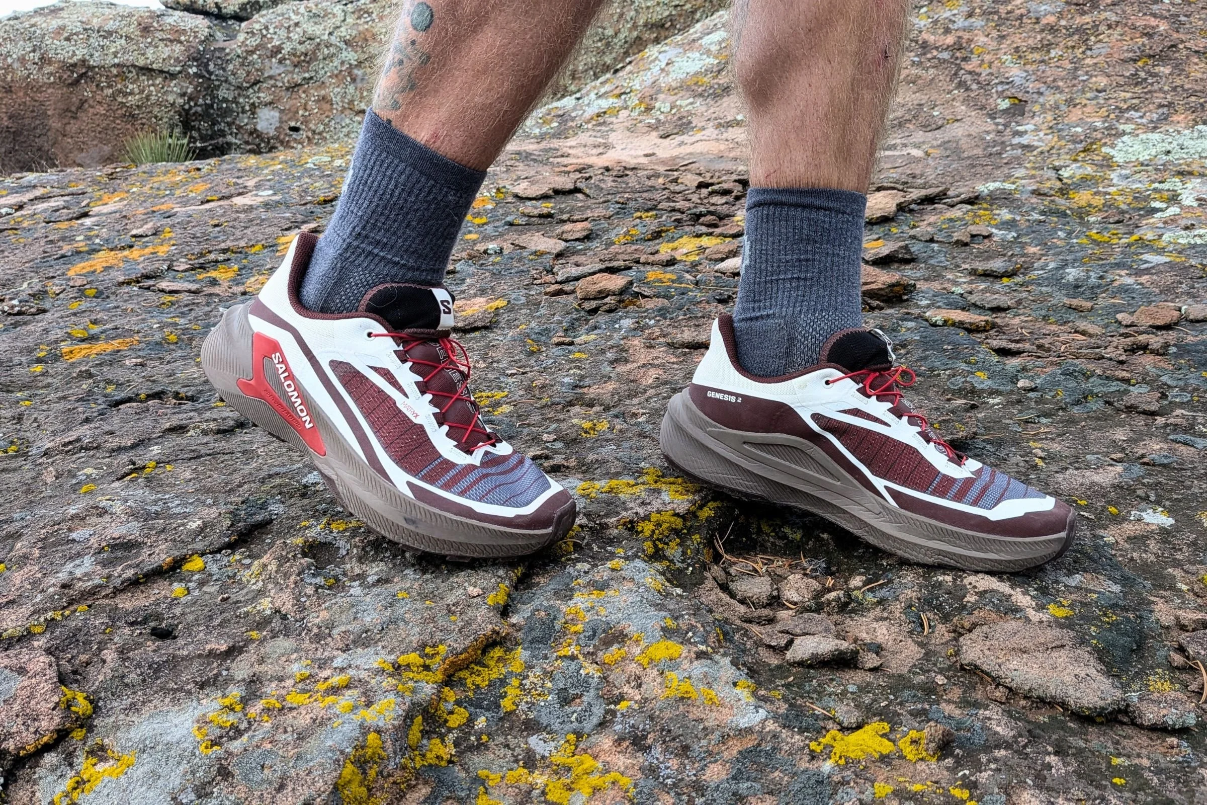 A close view of  Salomon Genesis 2 Trail Running Shoes on rocky terrain.