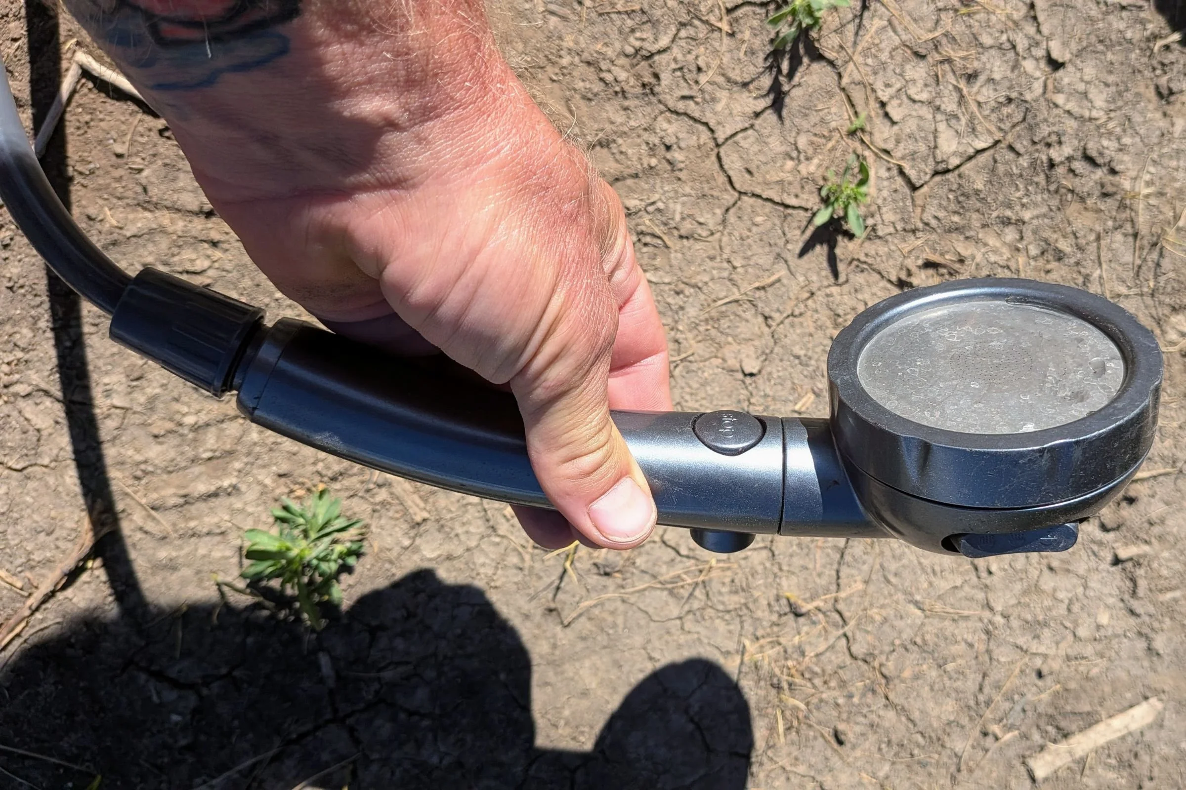 A closeup of the BougeRV portable water heater's shower wand
