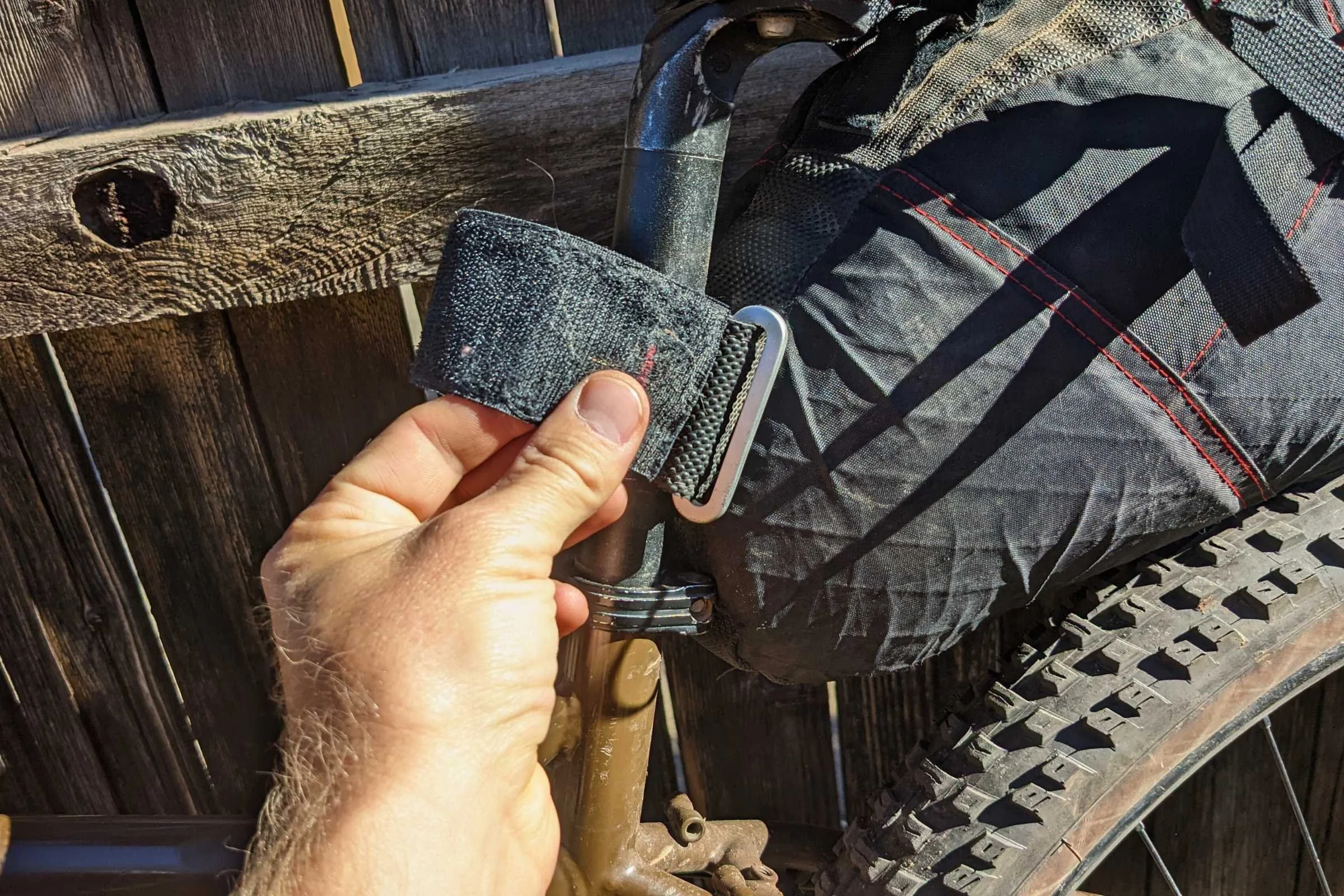 Using the strap to attach a bag to the seat post.