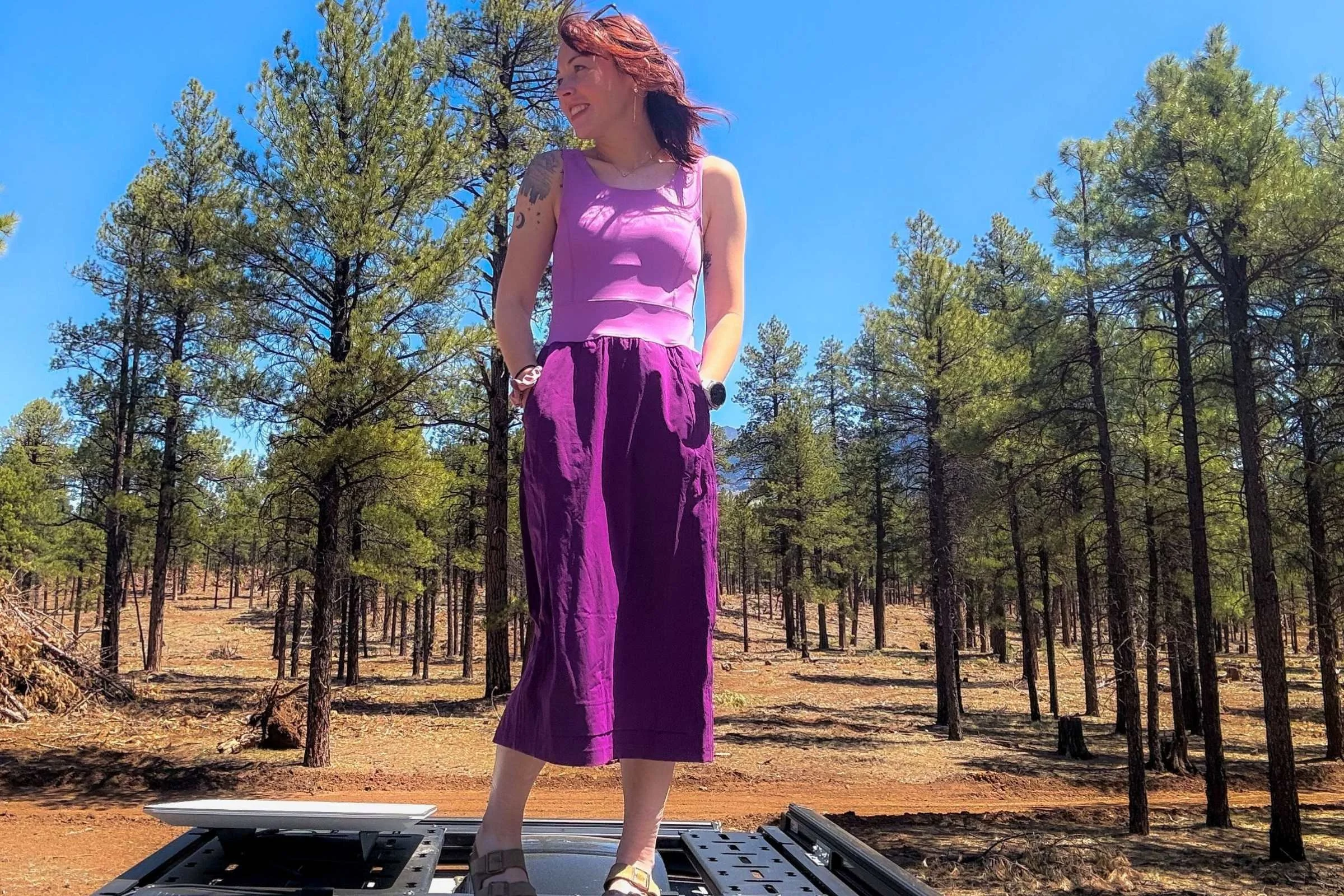 Woman wearing the Title Nine Limitless Mid Dress out in nature
