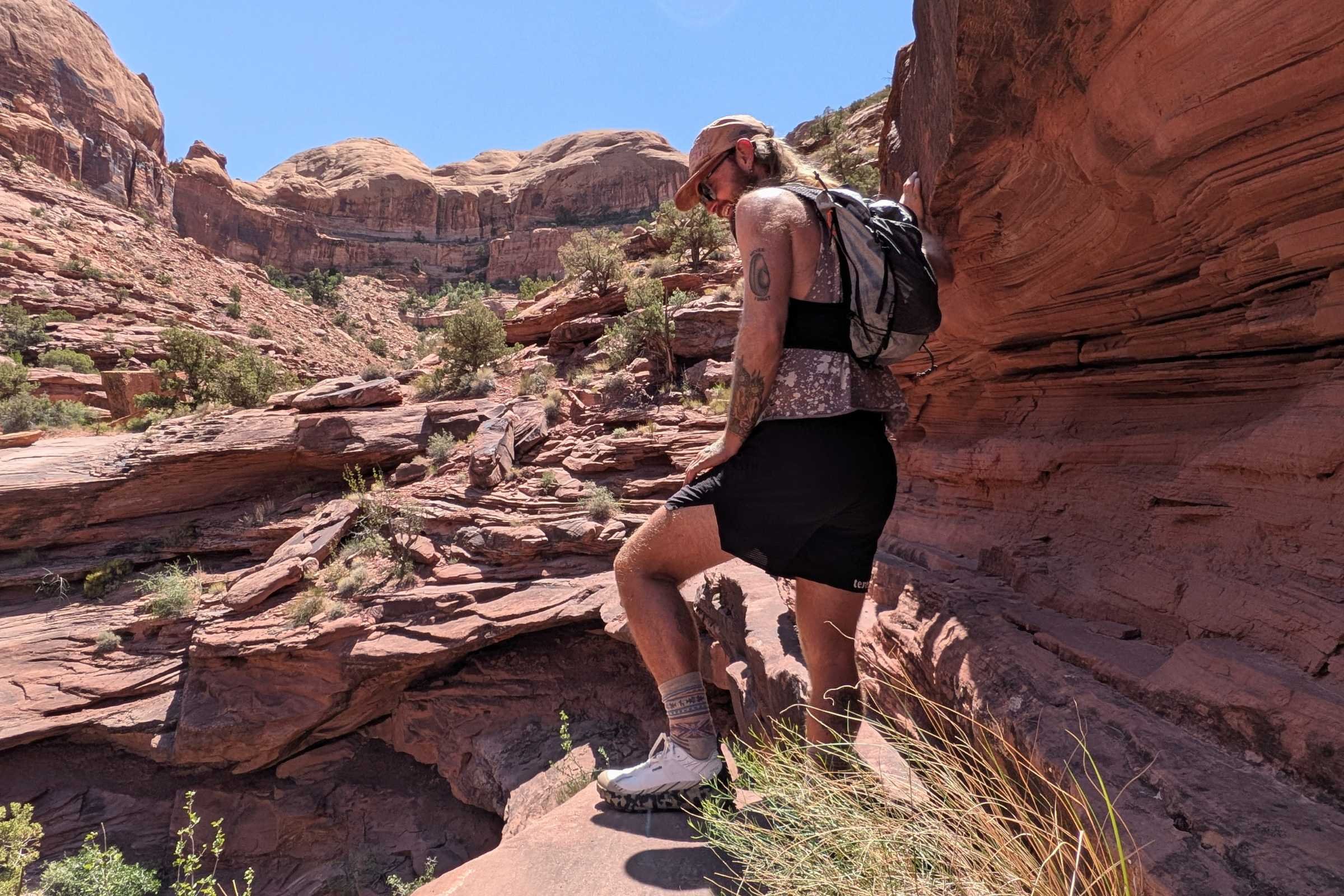 Hyperlite Mountain Gear Pemi 15 Running Vest side profile showing the slim, body-hugging fit on a runner