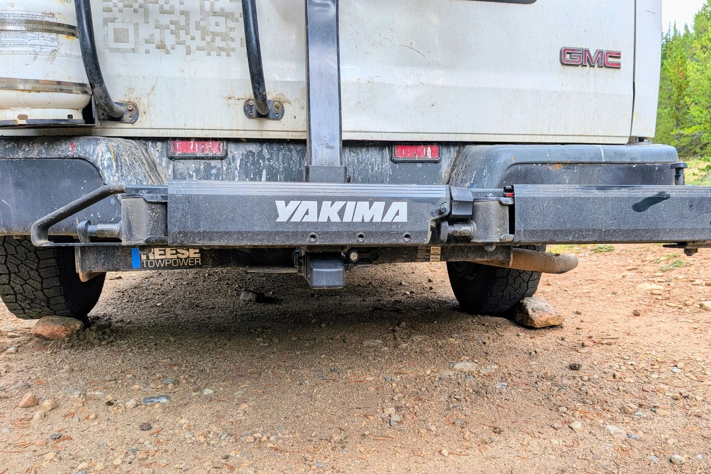 The rear end of a truck parked on the roadside with a Yakima EXO Swing visible.