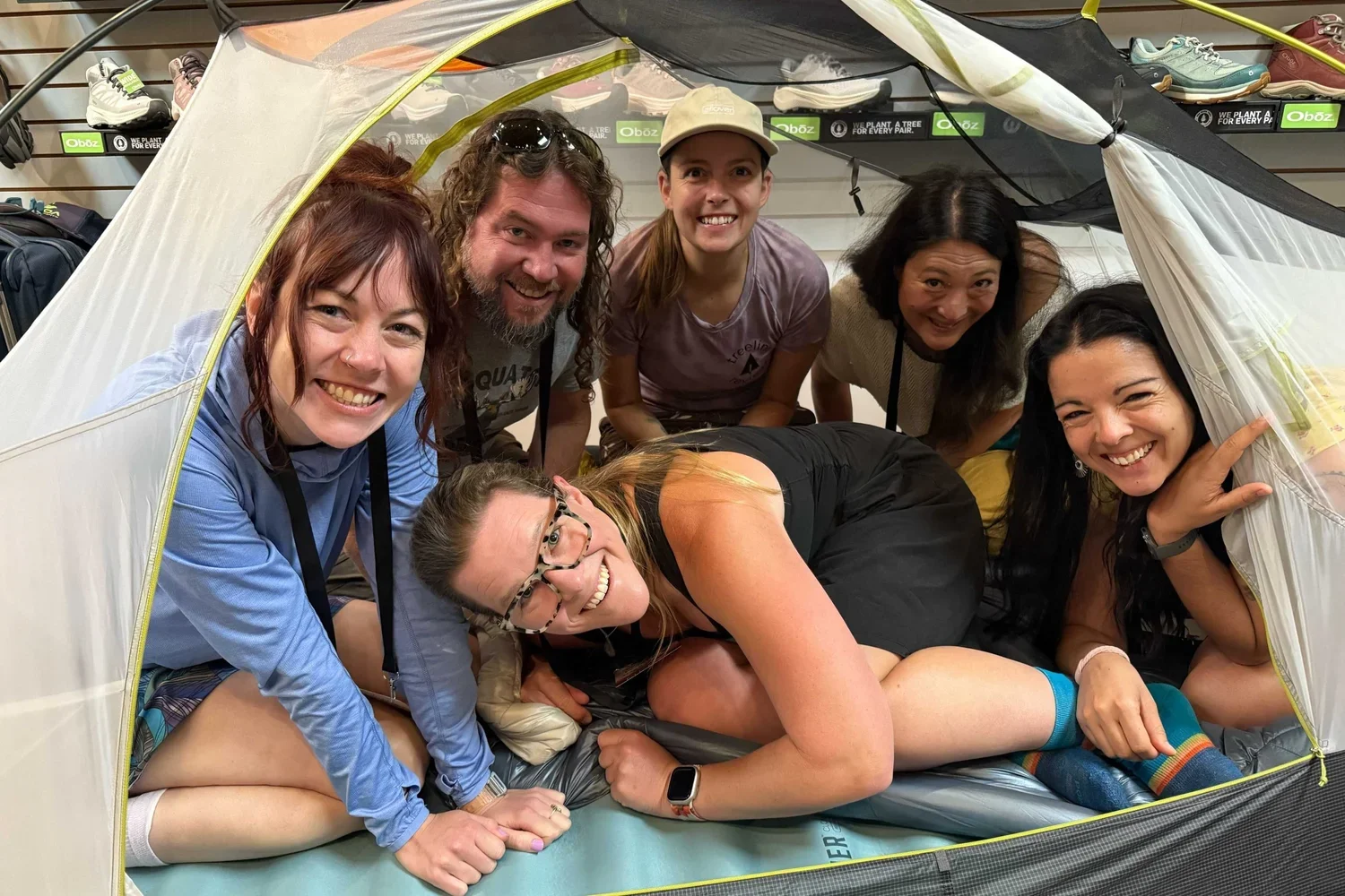 treeline review writers in a tent