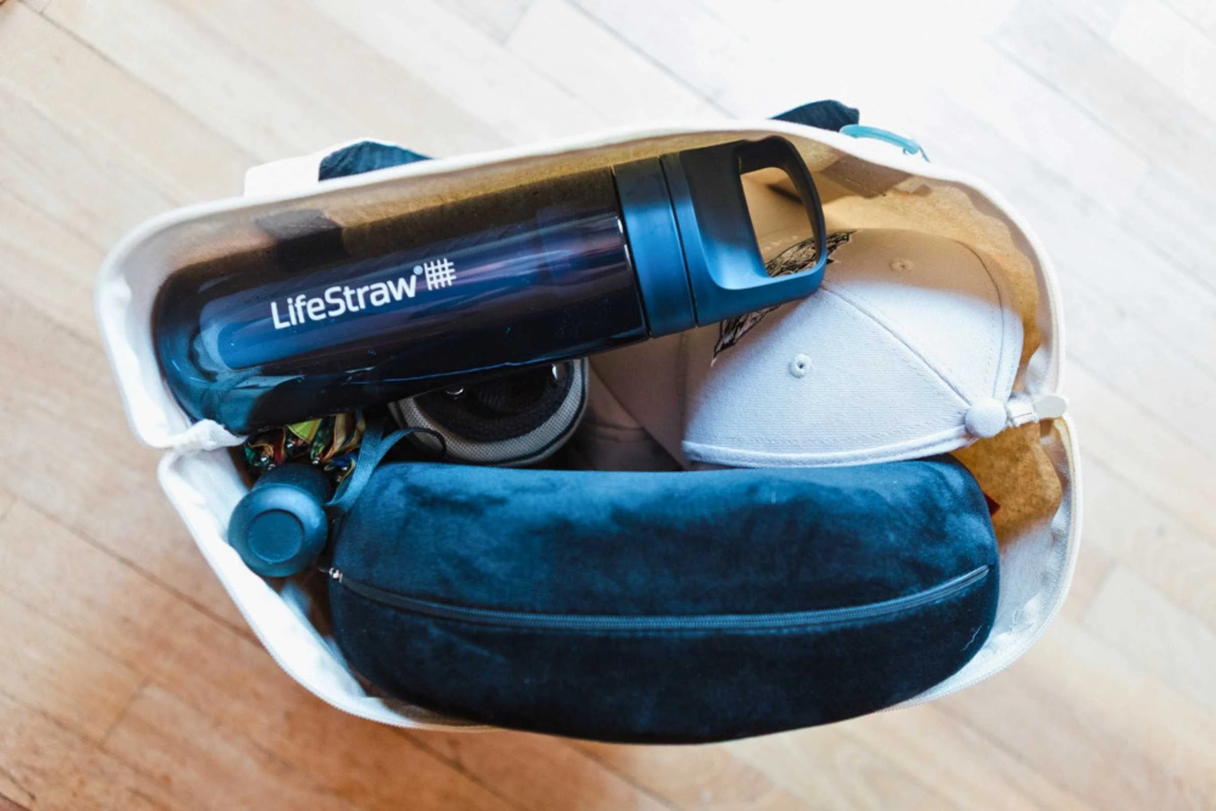 A travel water bottle lying on its side inside a packed bag, showing no leakage. Photo courtesy Karthika Gupta