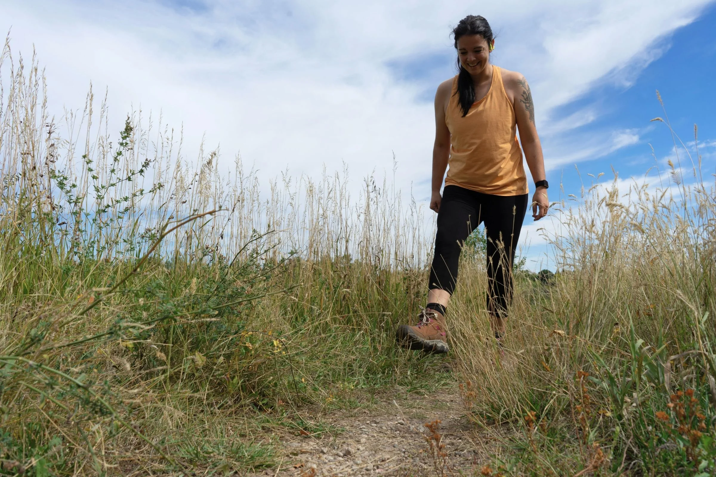 Walking down a gravel trail to test the KEEN Targhee IV Mid Waterproof women’s hiking boots