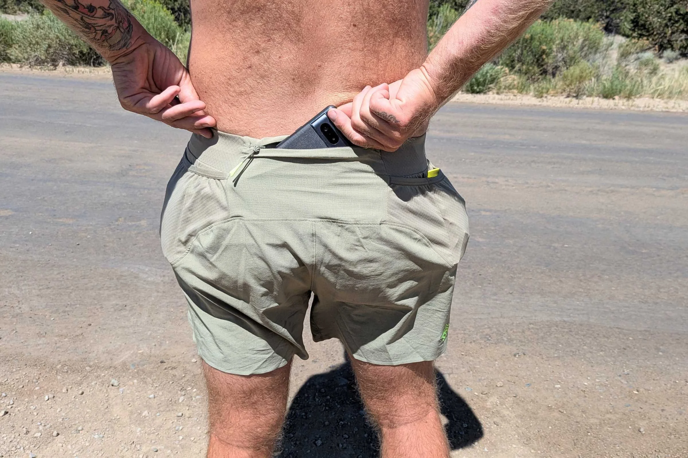 The rabbit FKT shorts have a large zippered phone pocket that’s large enough for a Google Pixel 10 with a silicone case and magnetic tripod