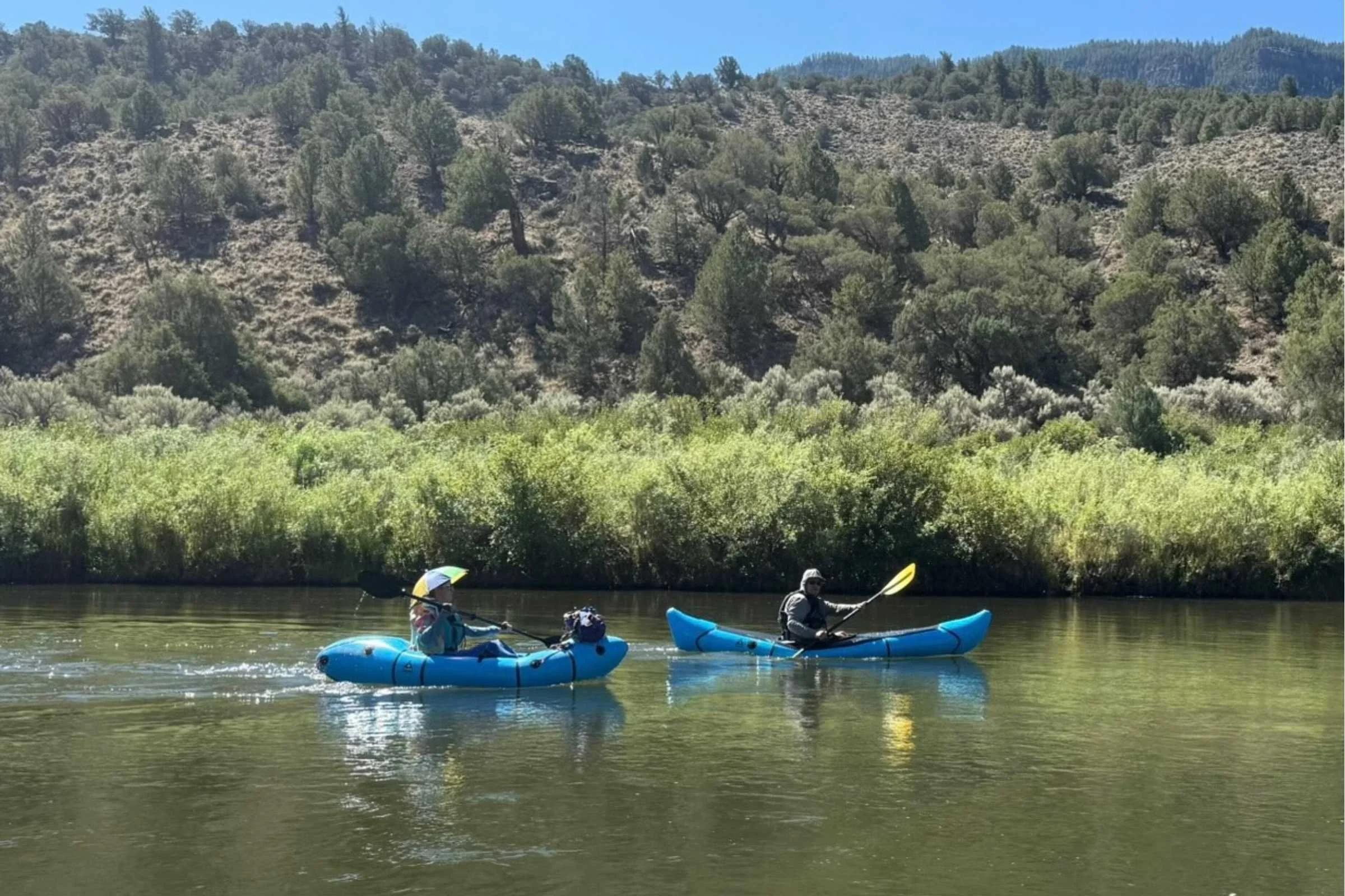 The Alpacka Chinook to the right is much longer than most packrafts, like the Alpacka Gnarwhal on the left, seen here in its smallest configuration.