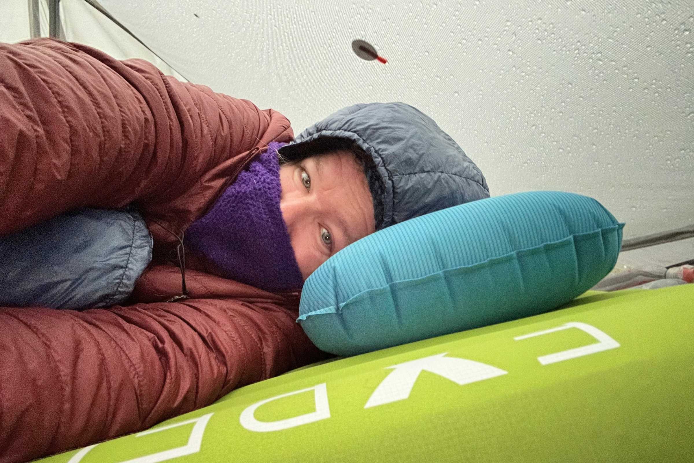 Tester with their complete sleep system, including the EXPED Ultra 6.5R sleeping pad