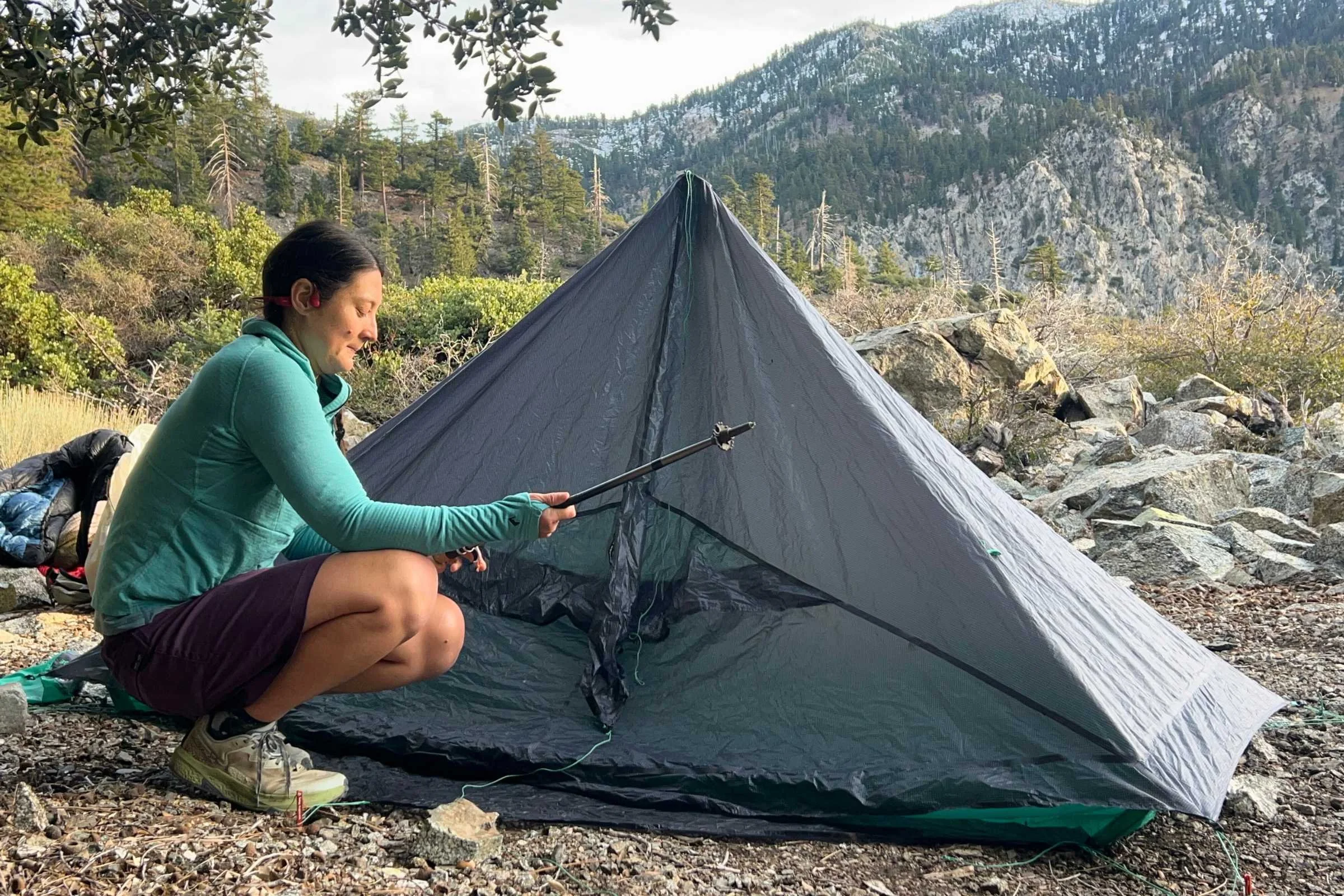 Backpacker setting up Big Agnes String Ridge VST tent using trekking pole