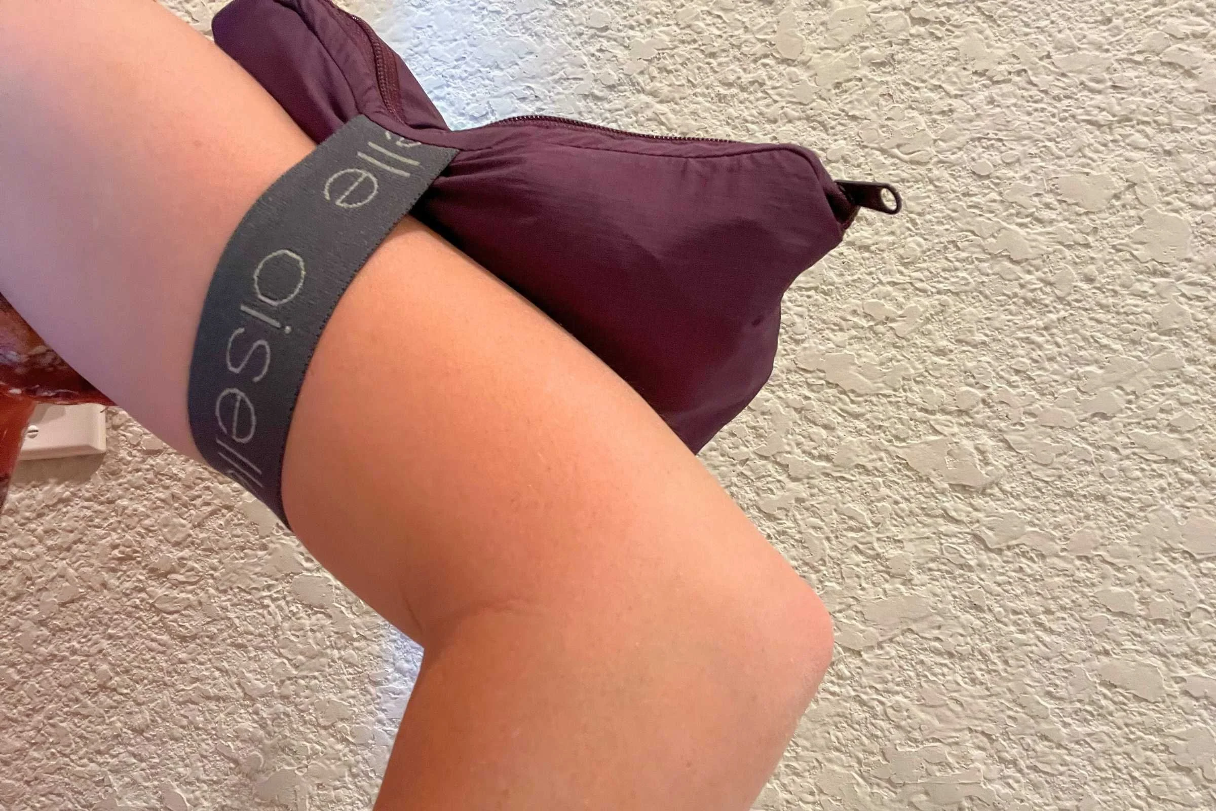 The Oiselle Vim comes with an arm strap to easily carry the running jacket if it becomes warm enough to shed a layer.