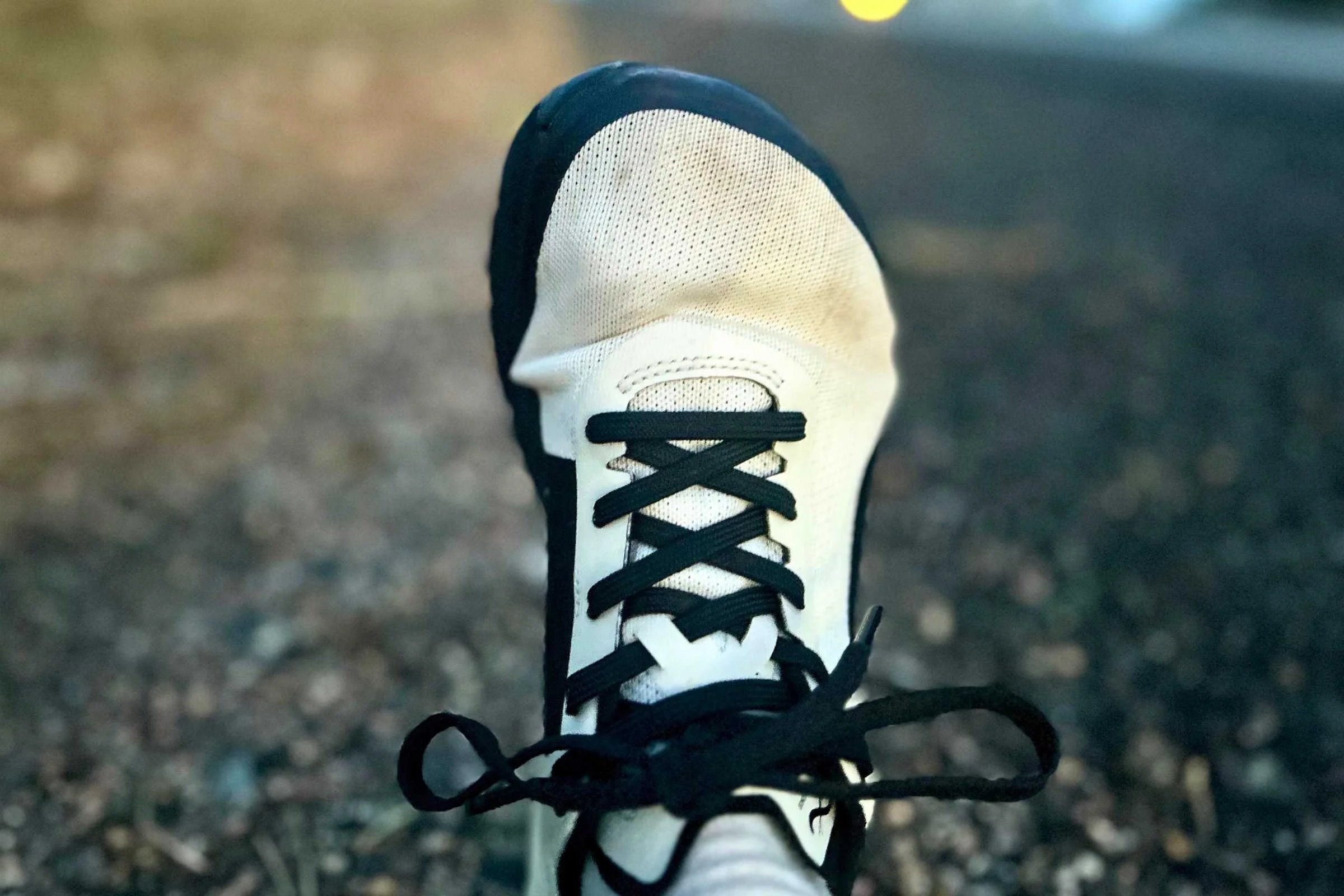 The Yama T1 upper after about 60 miles in the shoes. In the background, you can see a dirt and gravel shoulder on a hill I ran often in testing.