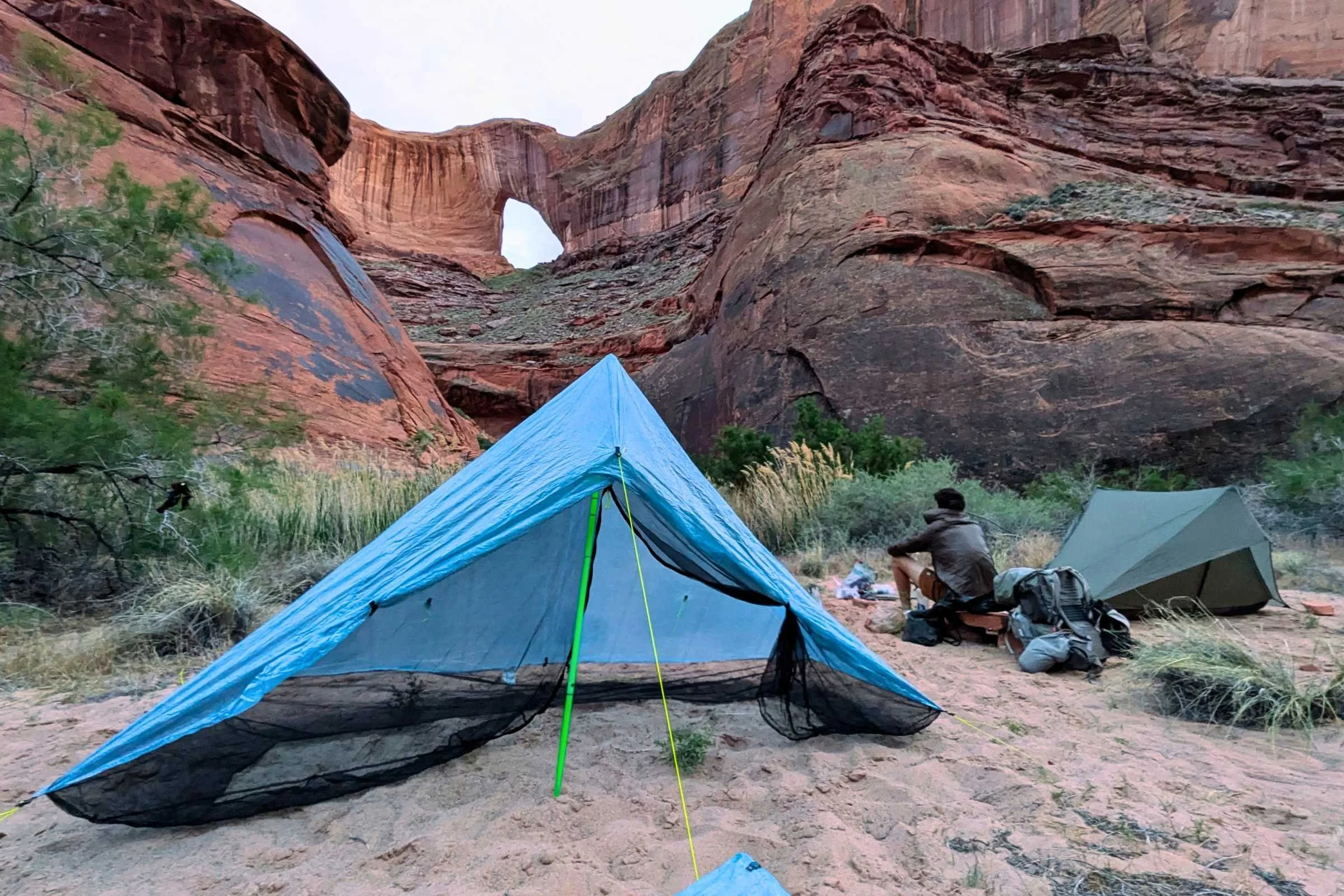 Zpacks Hexamid Ultralight Tent set up in the desert near a rock formation.