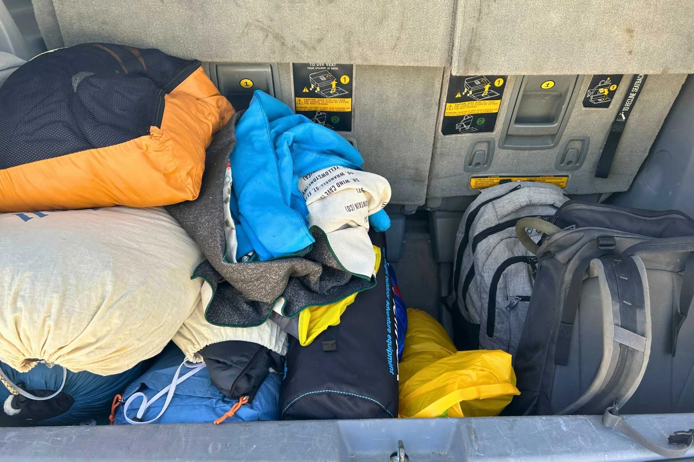 Loading up all the blankets for a camping trip with 7 people in the Eastern Sierra.