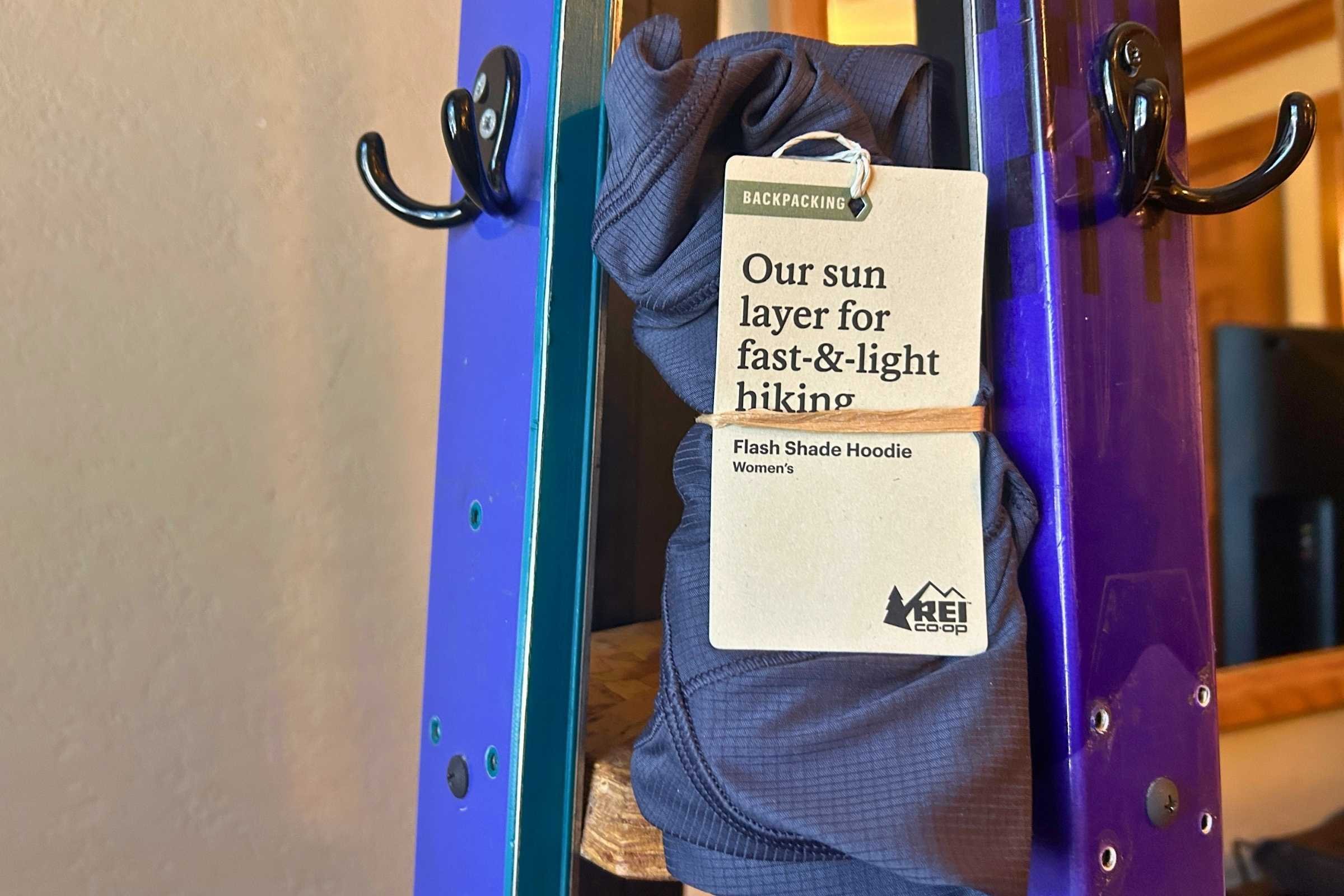 The REI Flash Shade hoodie has minimal packaging that has no plastic.