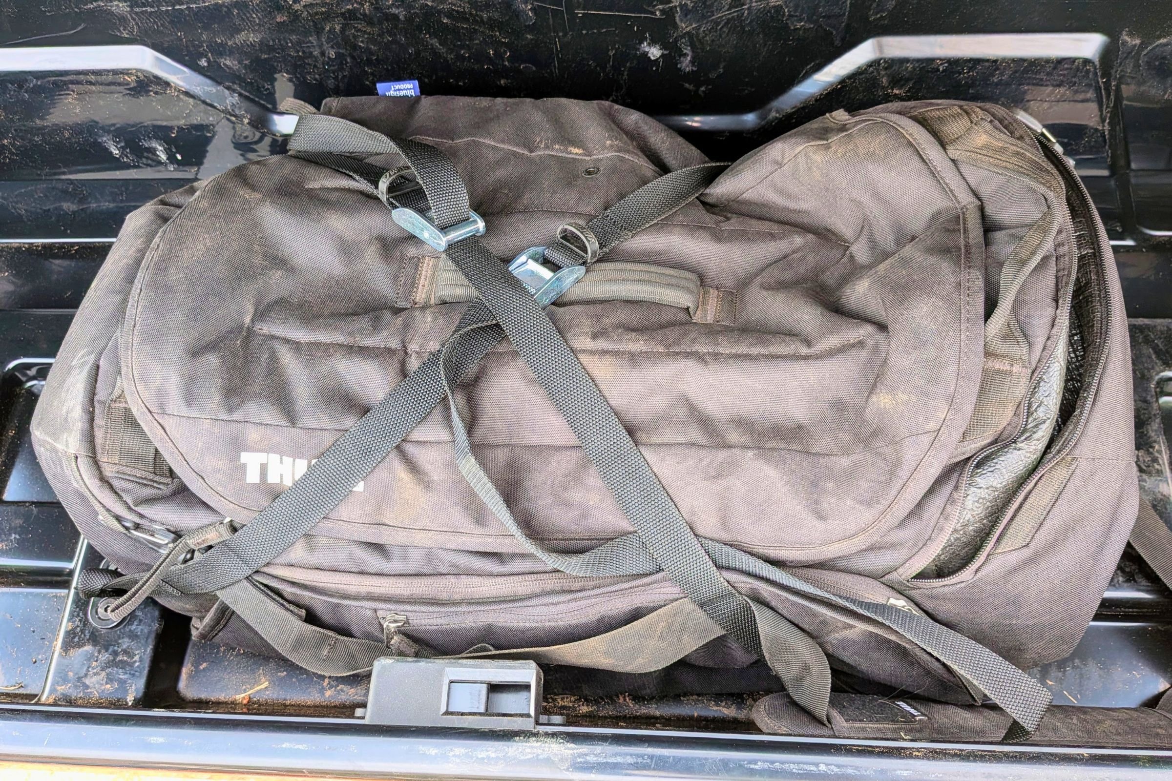 Yakima EXO GearLocker with a bag strapped in with the GearLocker cam straps to keep it secure