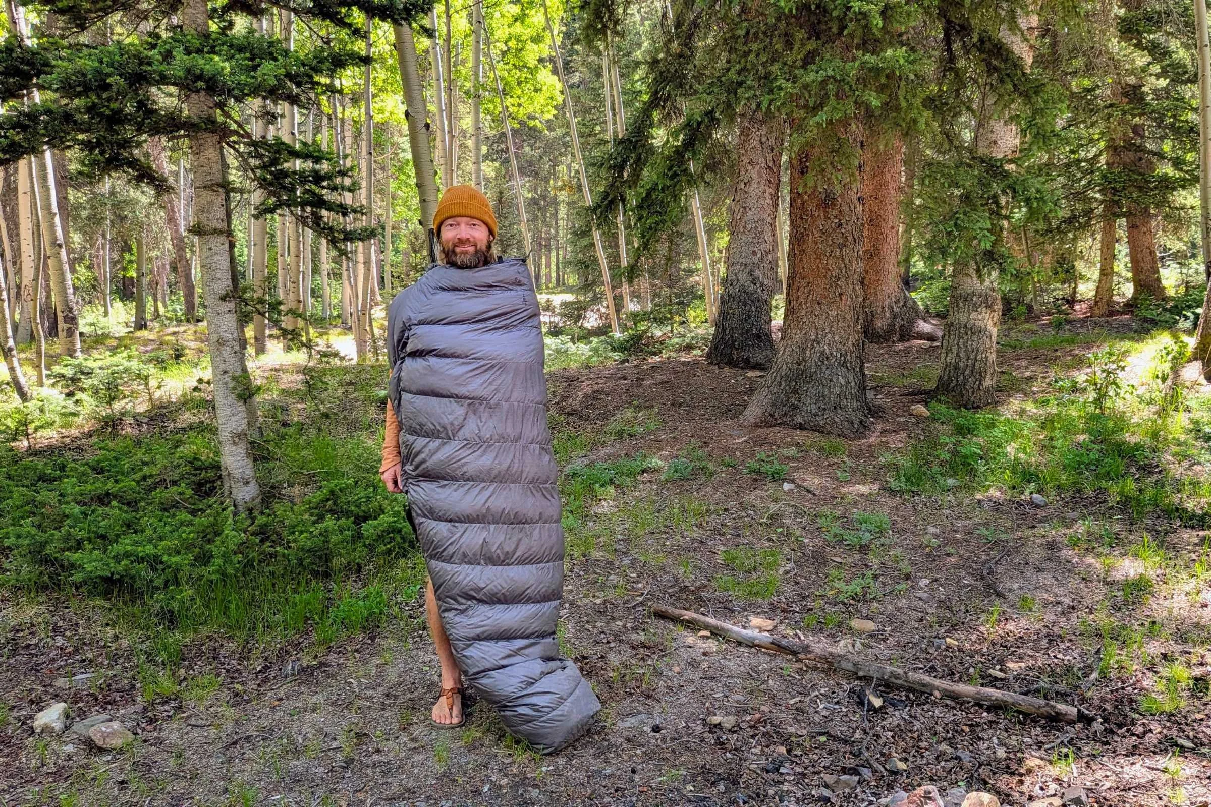 Outdoor Vitals StormLoft 15 Down TopQuilt — man in the woods
