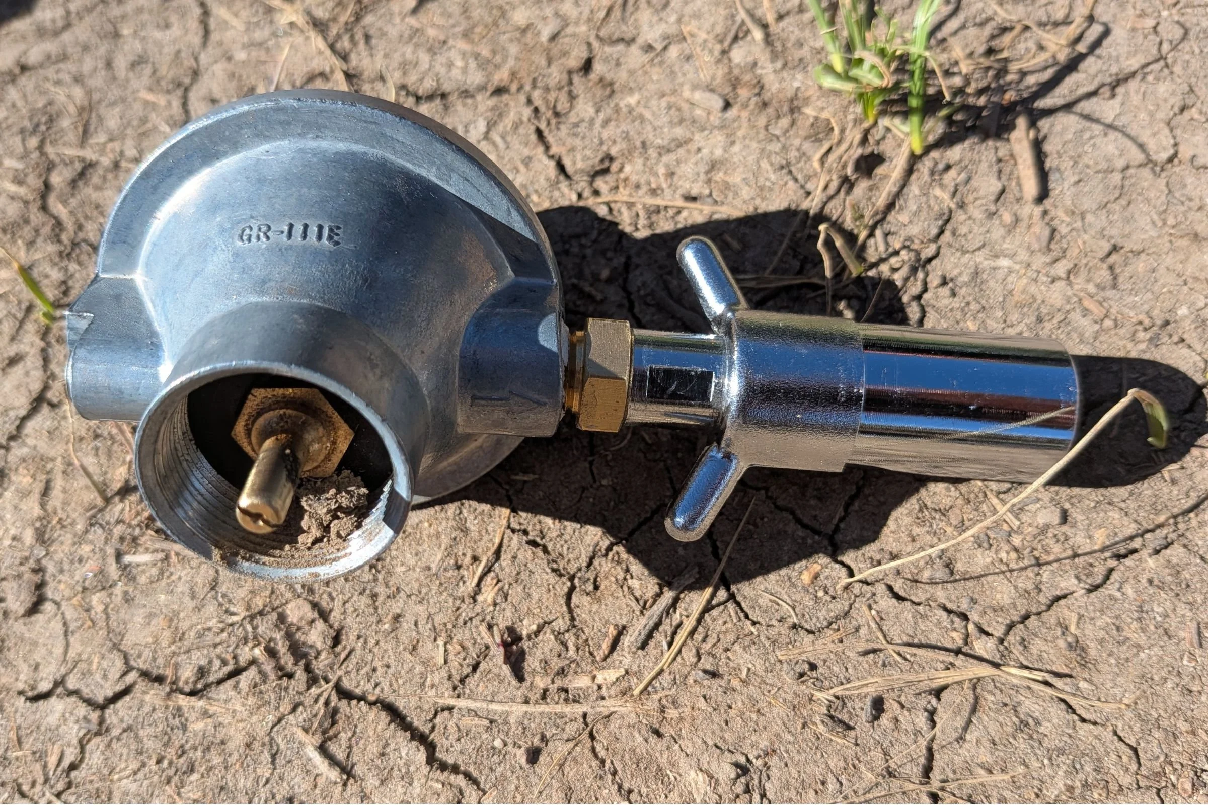 A closeup of the gas valve on the BougeRV portable water heater.