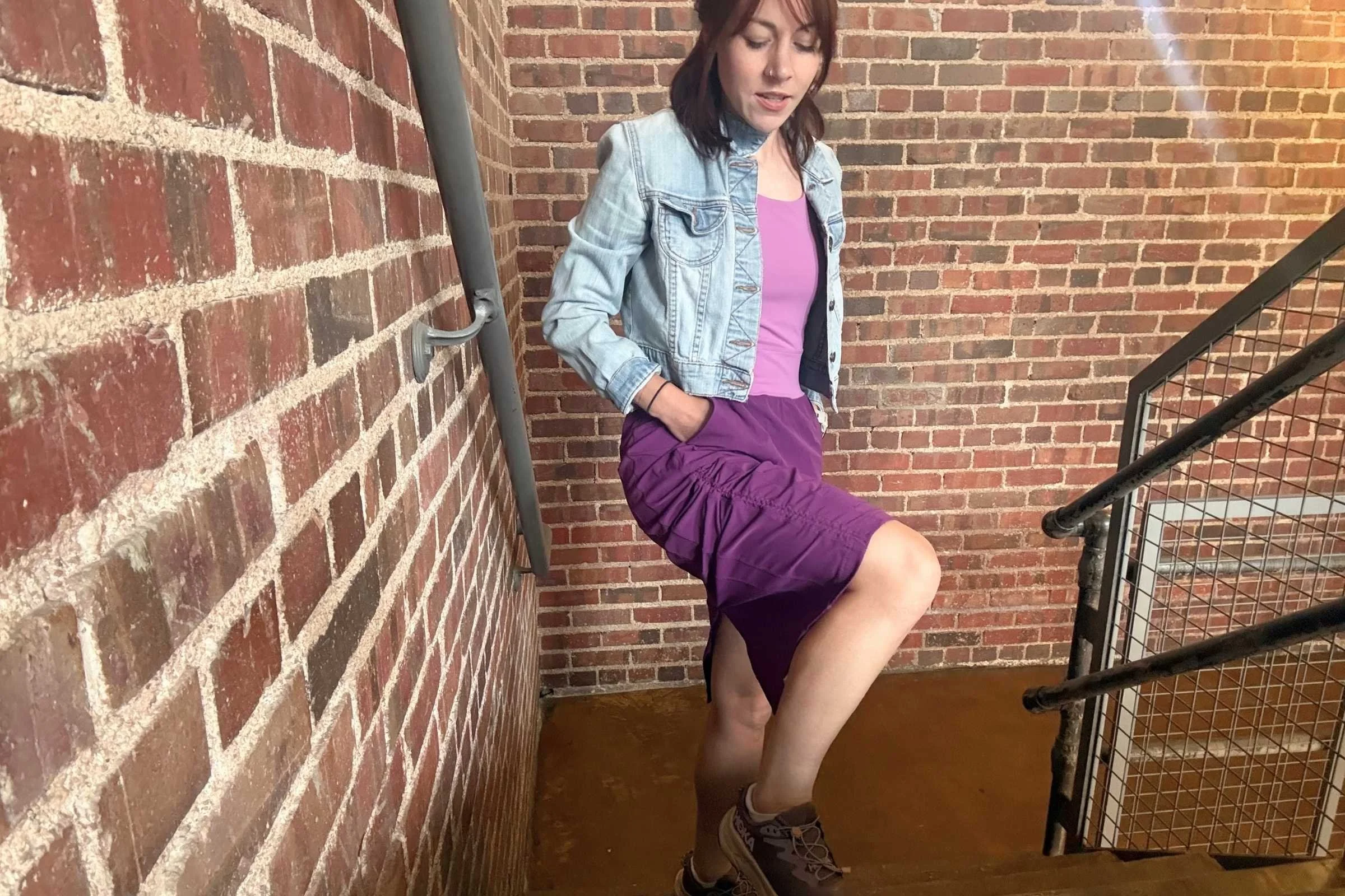Woman wearing a midi dress on outdoor stairs