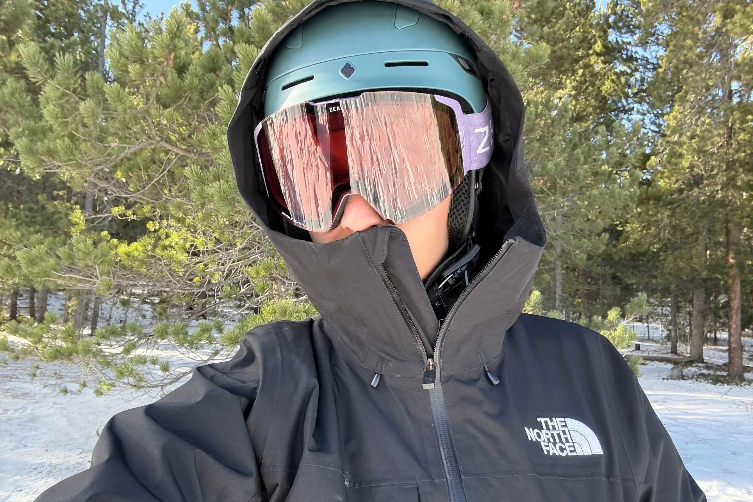 The North Face Thermoball Triclimate jacket hood covering snowboard helmet