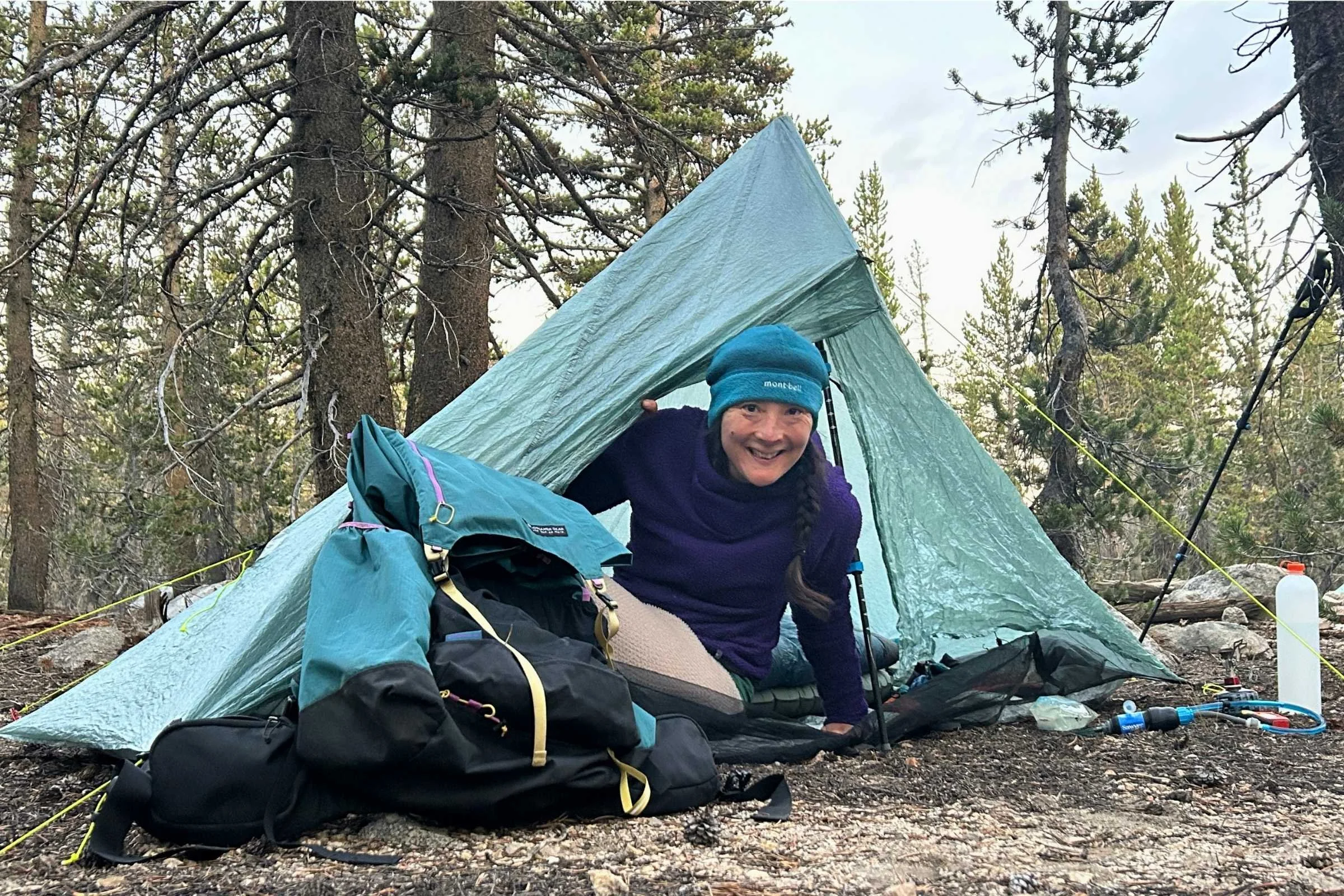 A person sitting in the Zpacks Plex Solo tent, looking out