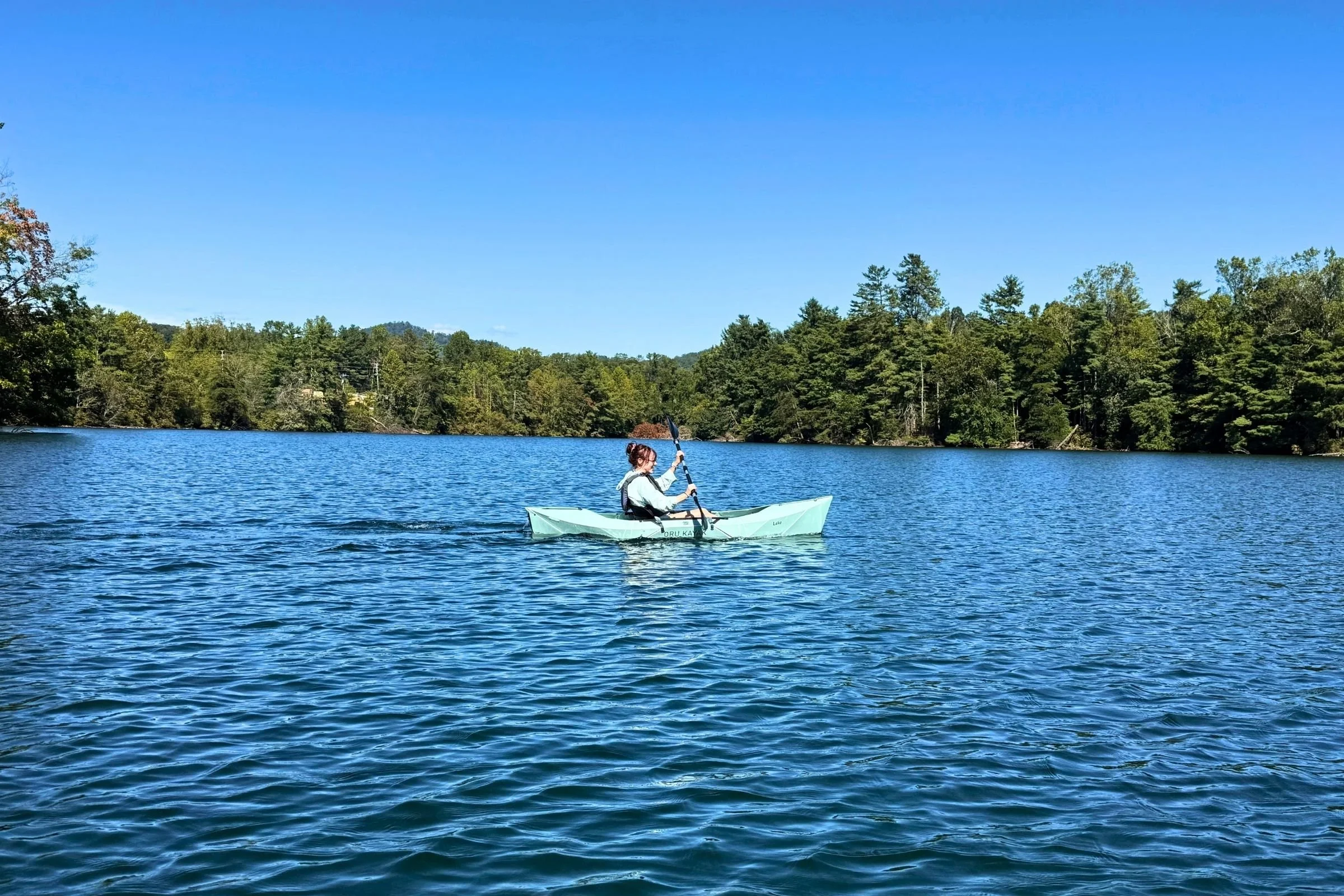 Woman in a foldable kayak.
