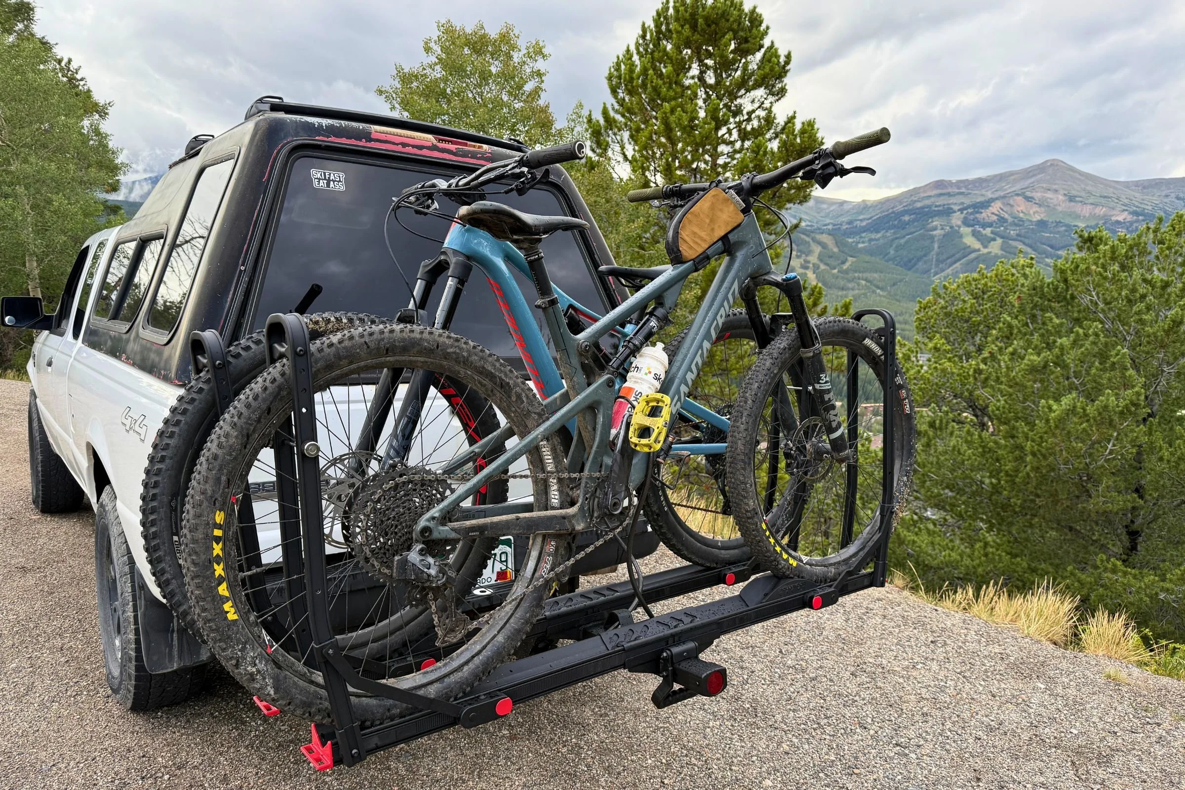 Hollywood Racks CrossTrack Hitch Bike Rack mounted on the rear of an SUV with bicycles loaded and secured.