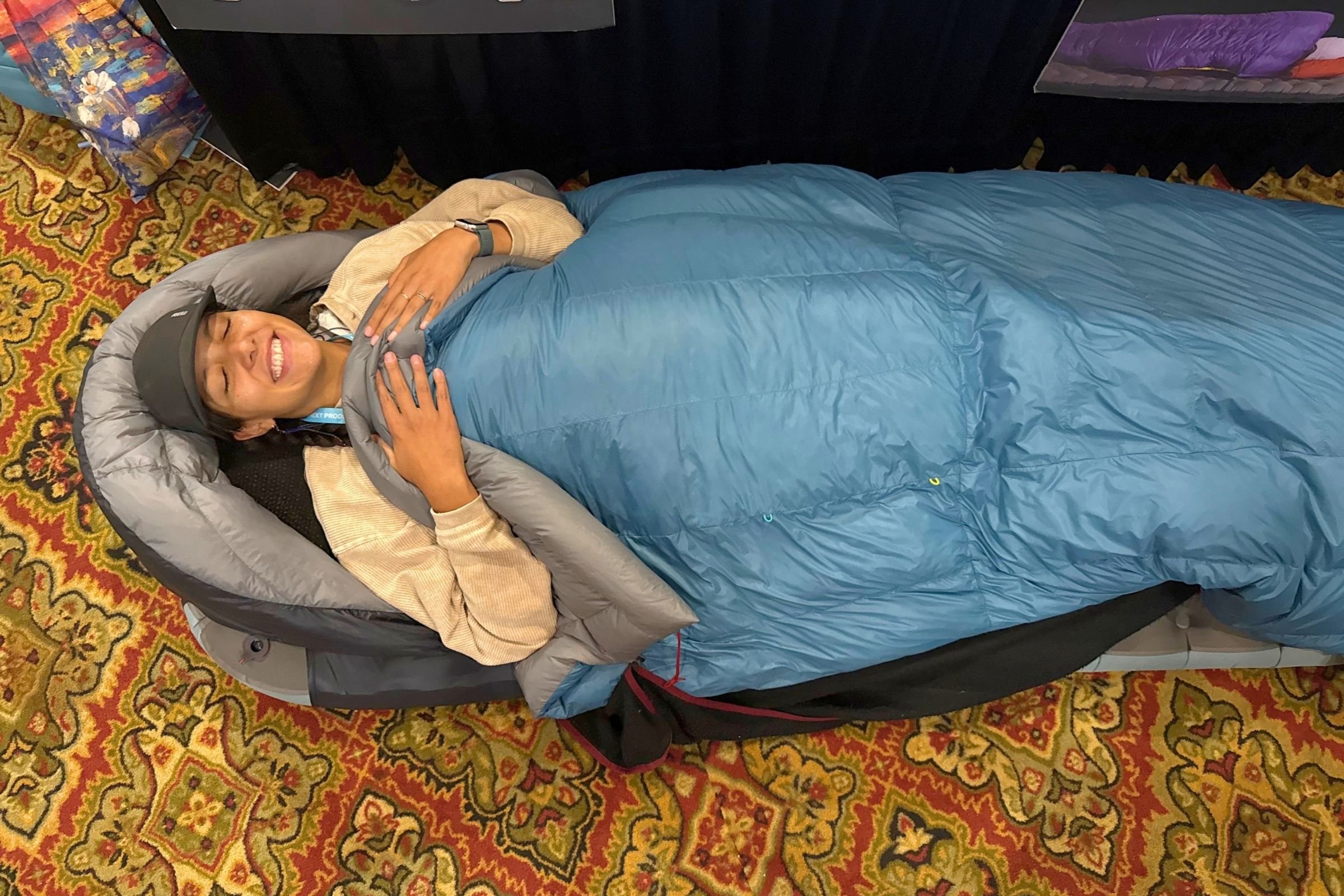Woman testing a sleeping system.