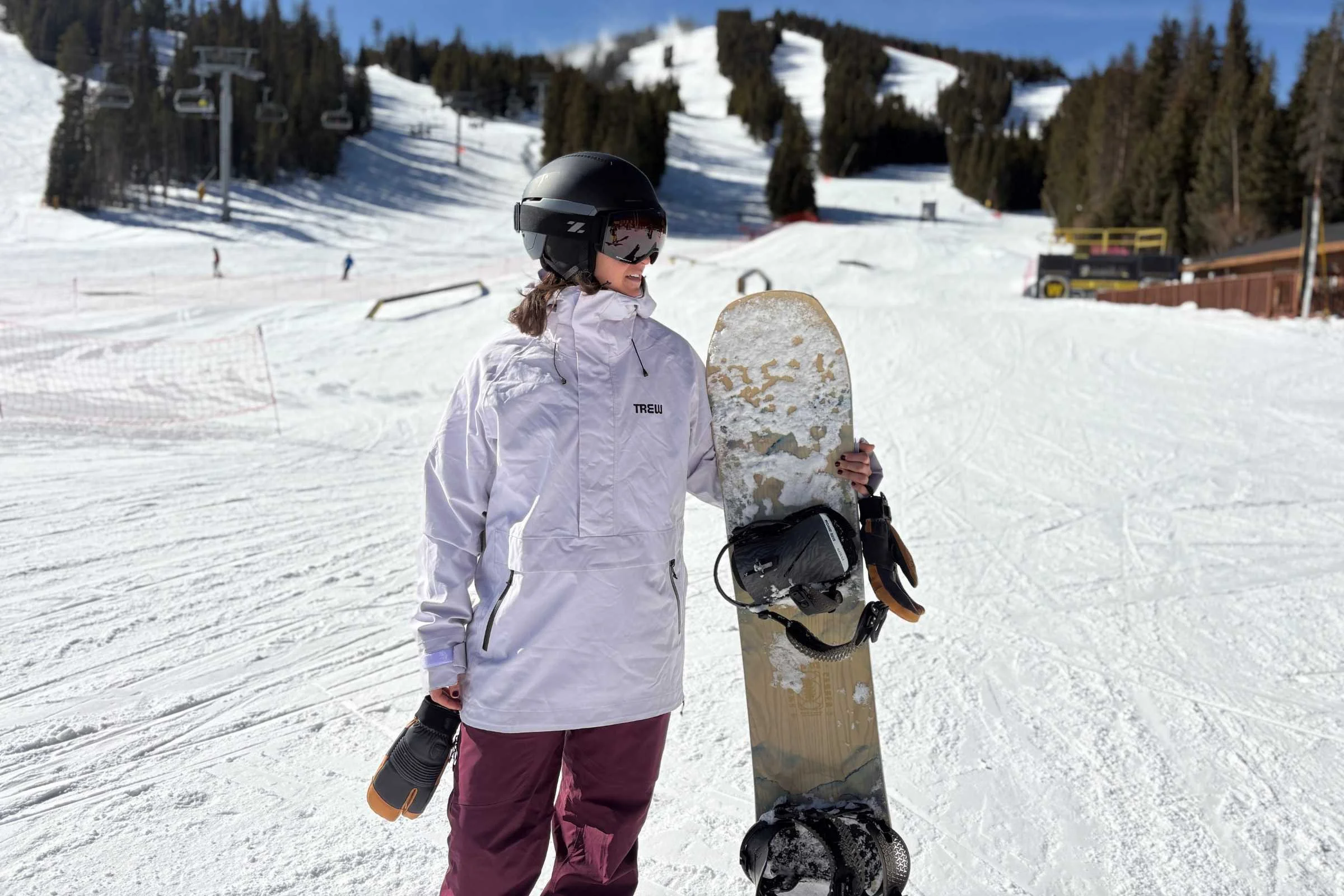 the author wearing a purple TREW Gear Popover jacket at a resort
