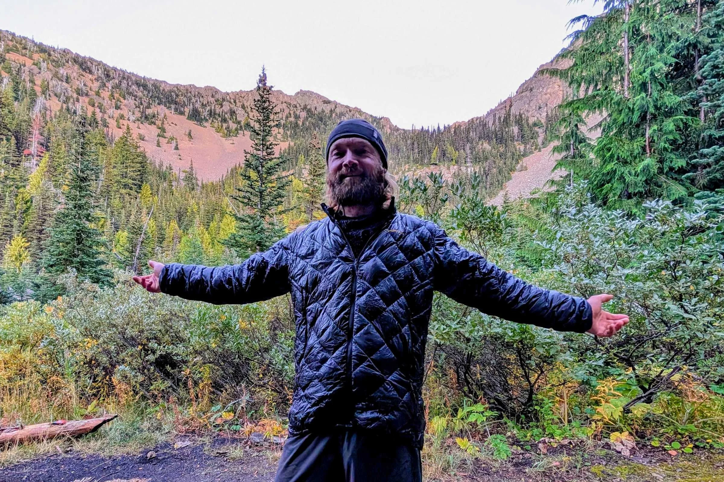 Man wearing La Sportiva Lumina jacket in alpine forest