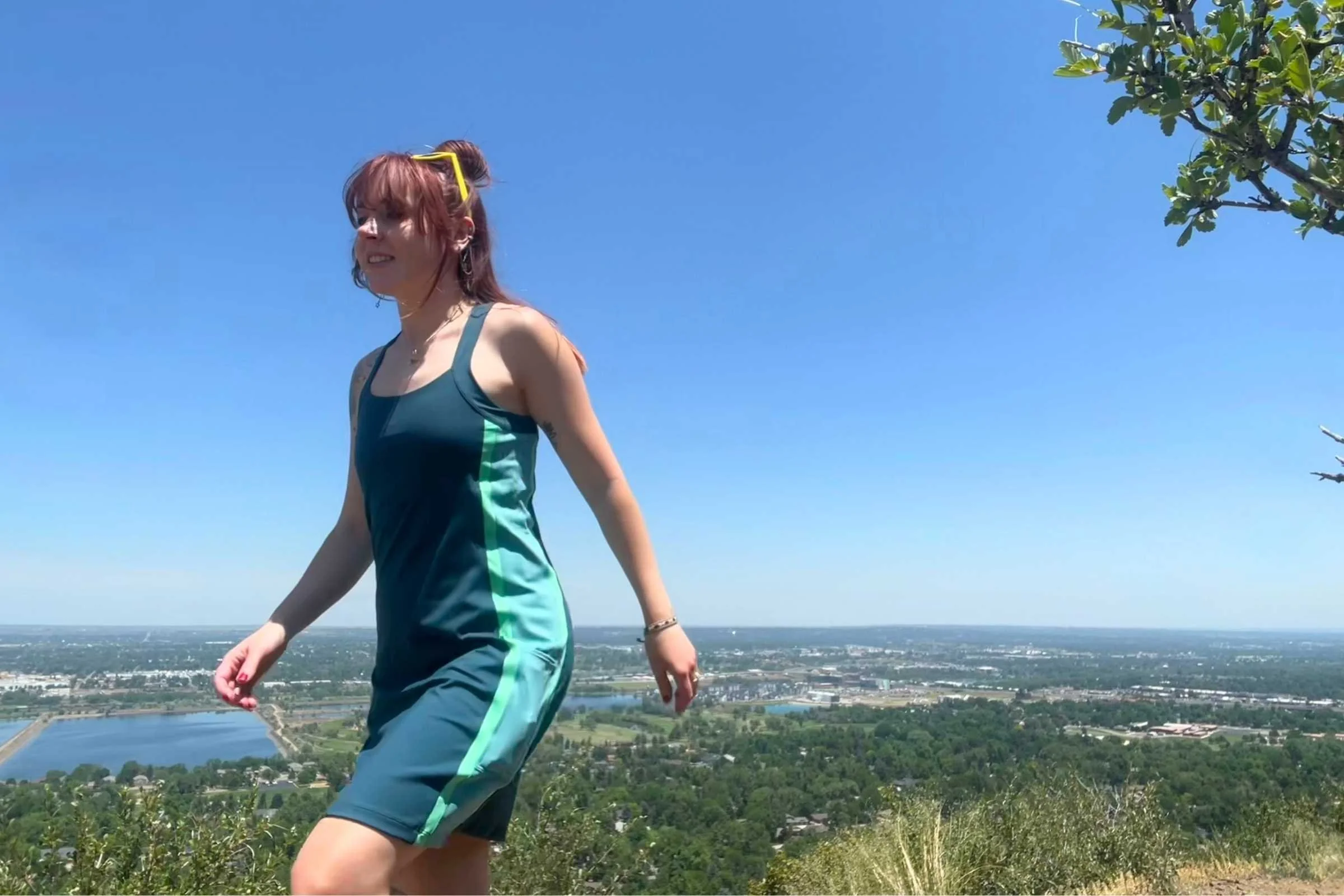 The author wearing the Cotopaxi Muevo dress on a hike in Golden, Colorado.