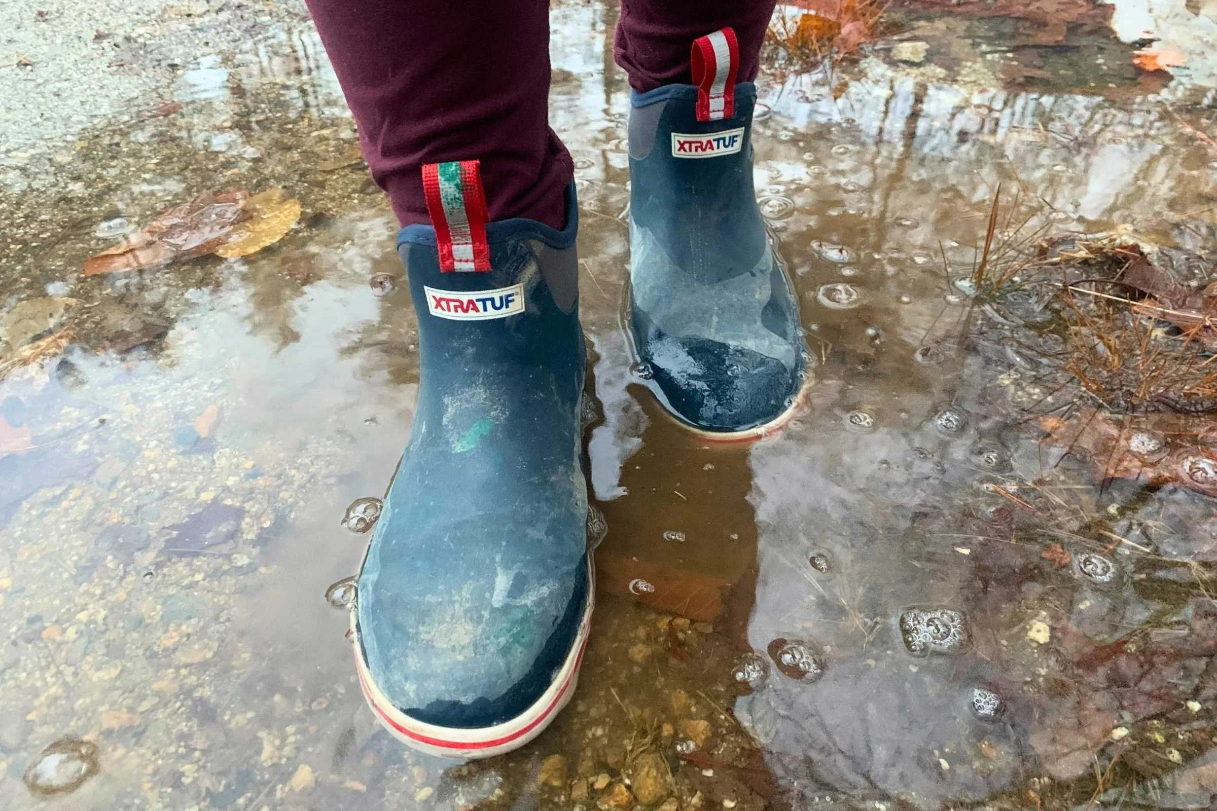 Xtratuf women's rain boots in a rain puddle
