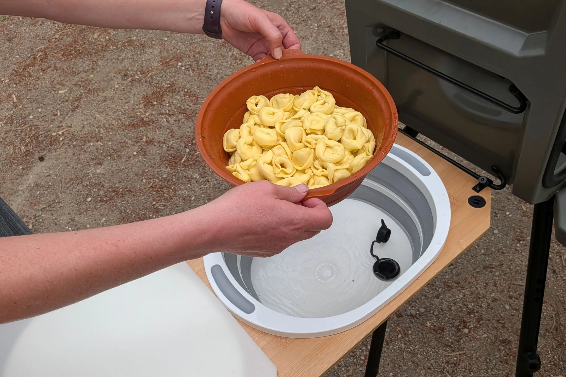 Yakima EXO OpenRange wash basin sink with its drain hose visible.