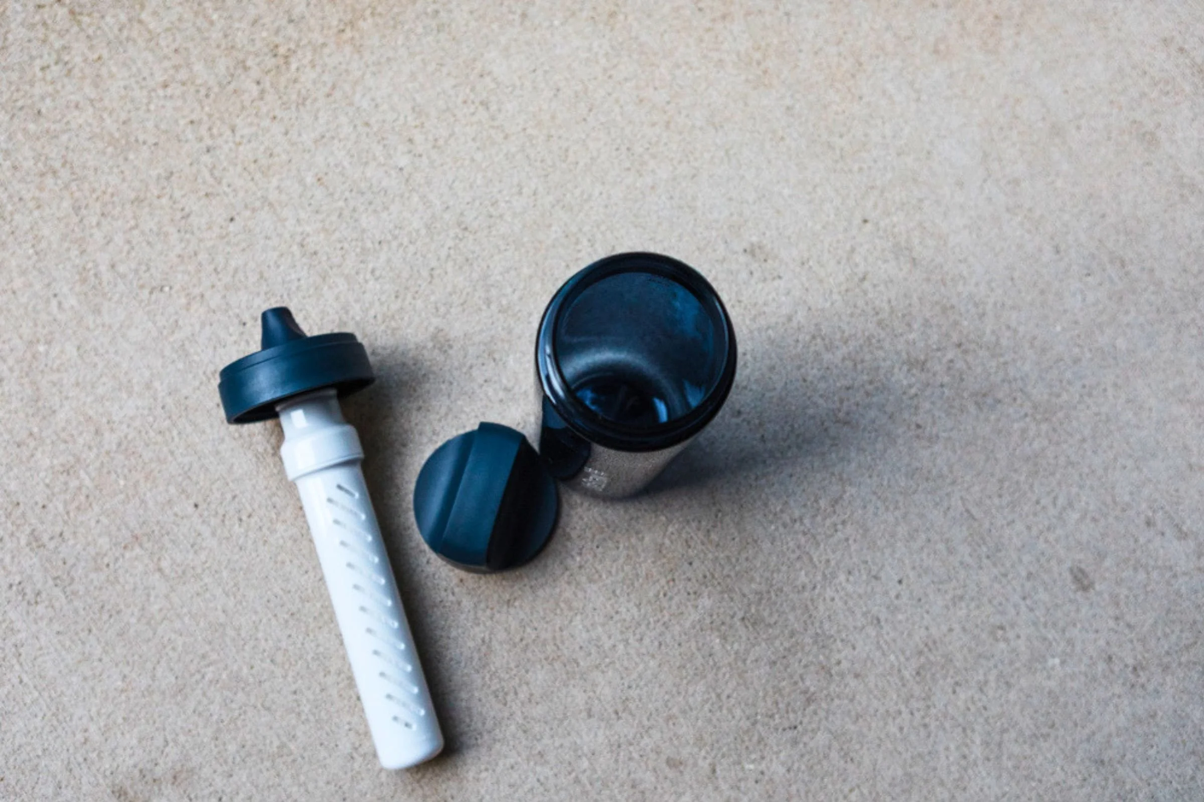 LifeStraw Go Series Travel Water Bottle views displayed against a white background, showing the integrated filter mechanism in the cap and mouth opening design.