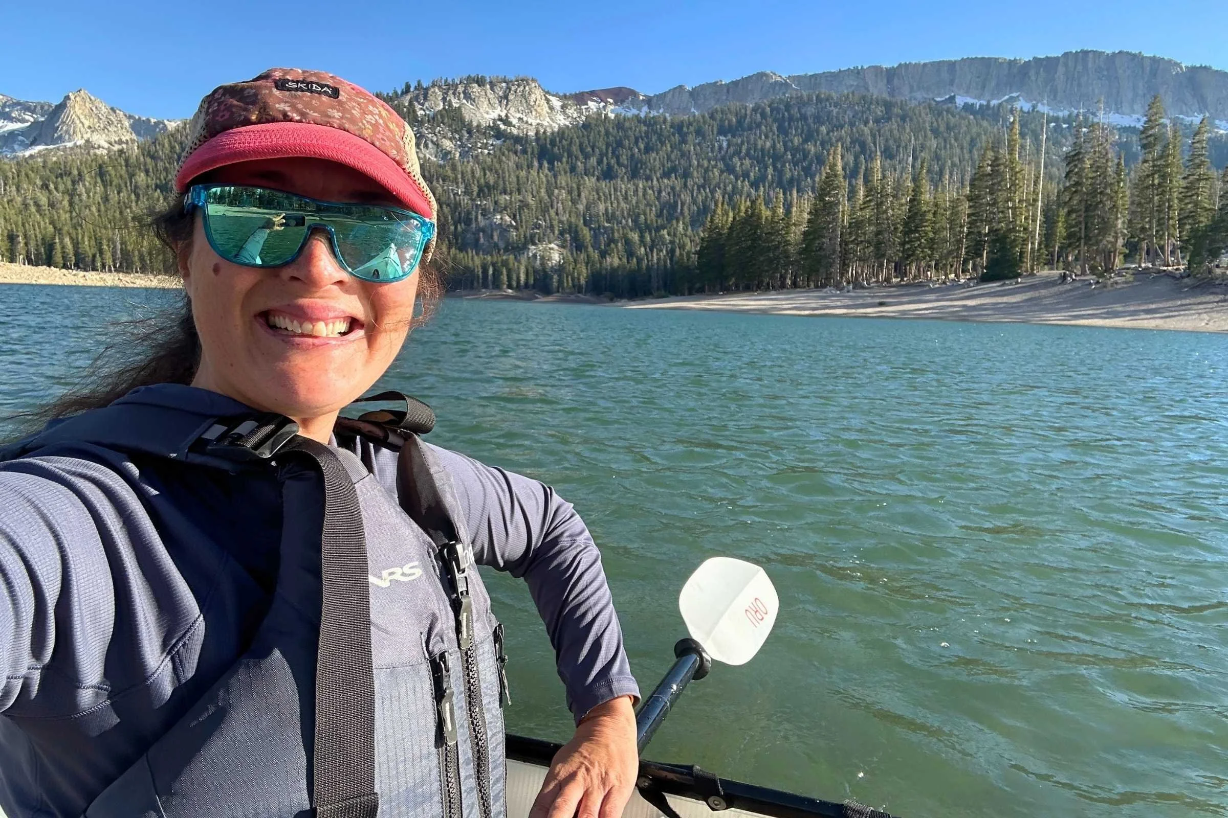 Testing the REI Flash Shade hoodie while kayaking on a high altitude lake in the Eastern Sierra.