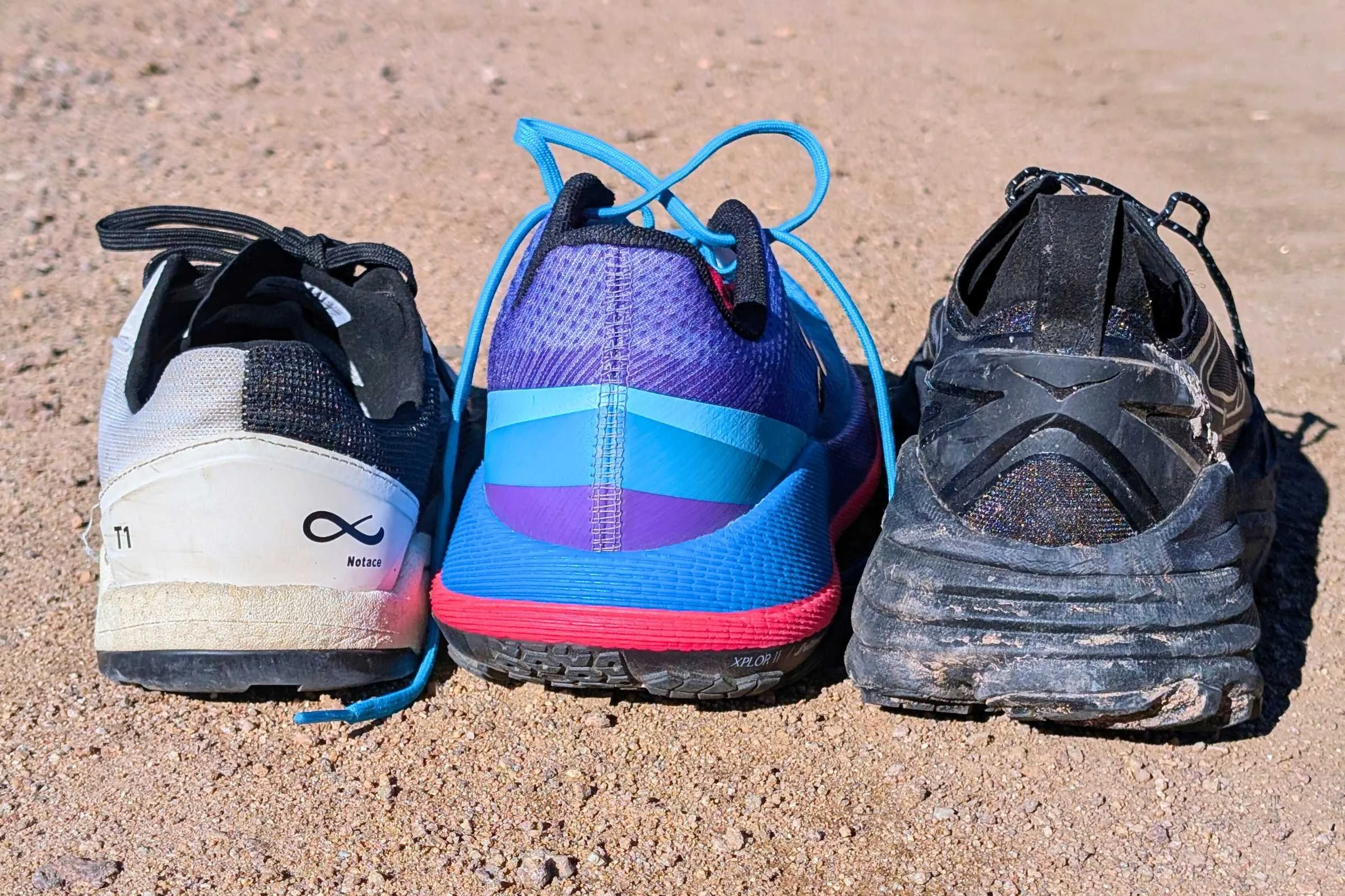 A closeup of the heel stack height of The Notace Yama T1, Craft Xplor 2, and HOKA Stinson One7.