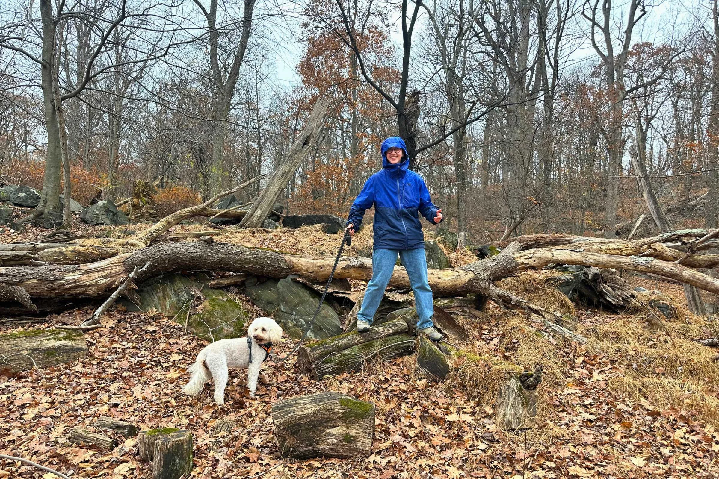 Outdoor Research Foray rain jacket worn on trail in wet weather, featuring Luna the dog