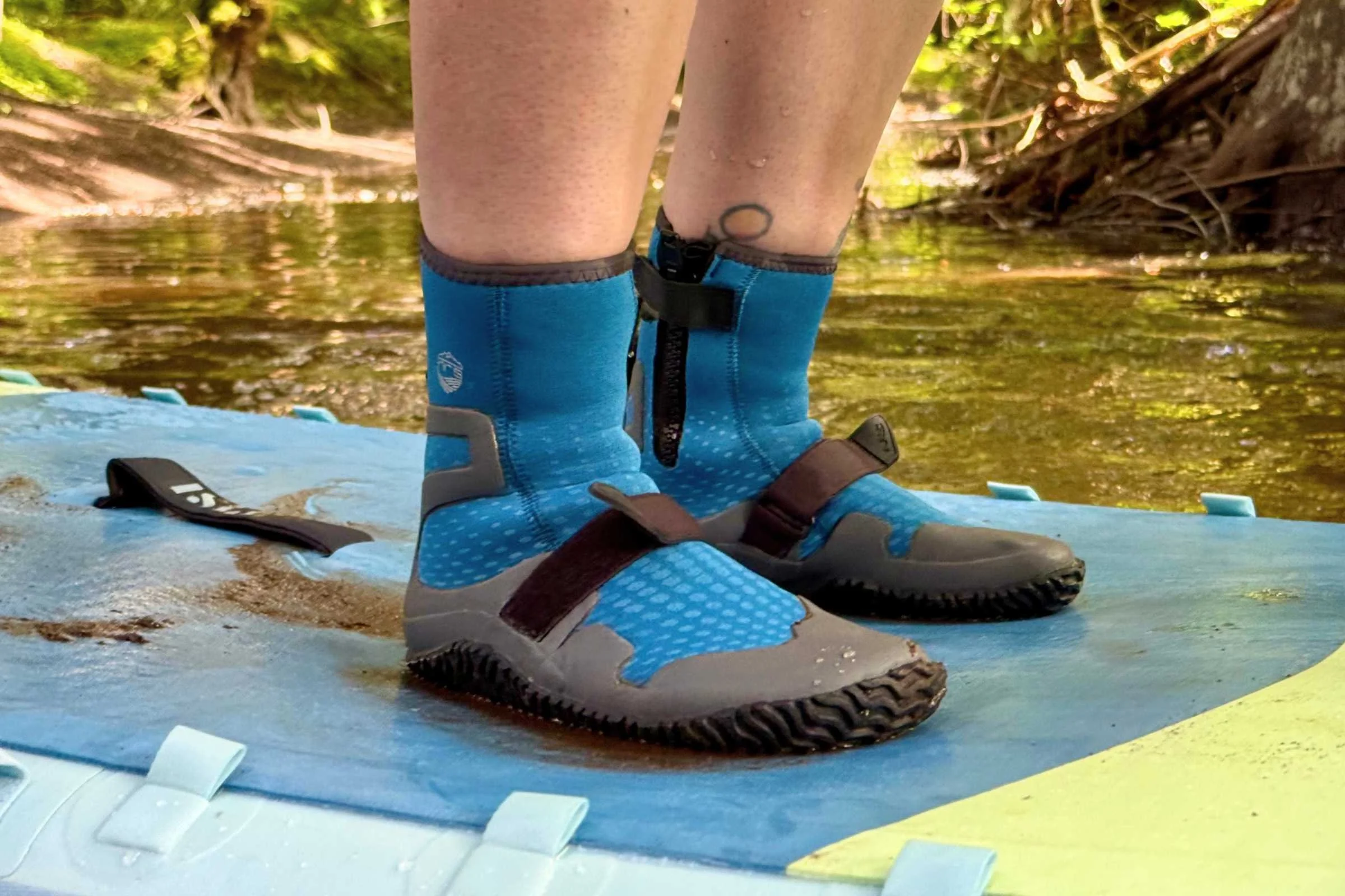 Person wearing NRS Paddle Wetshoe on a SUP