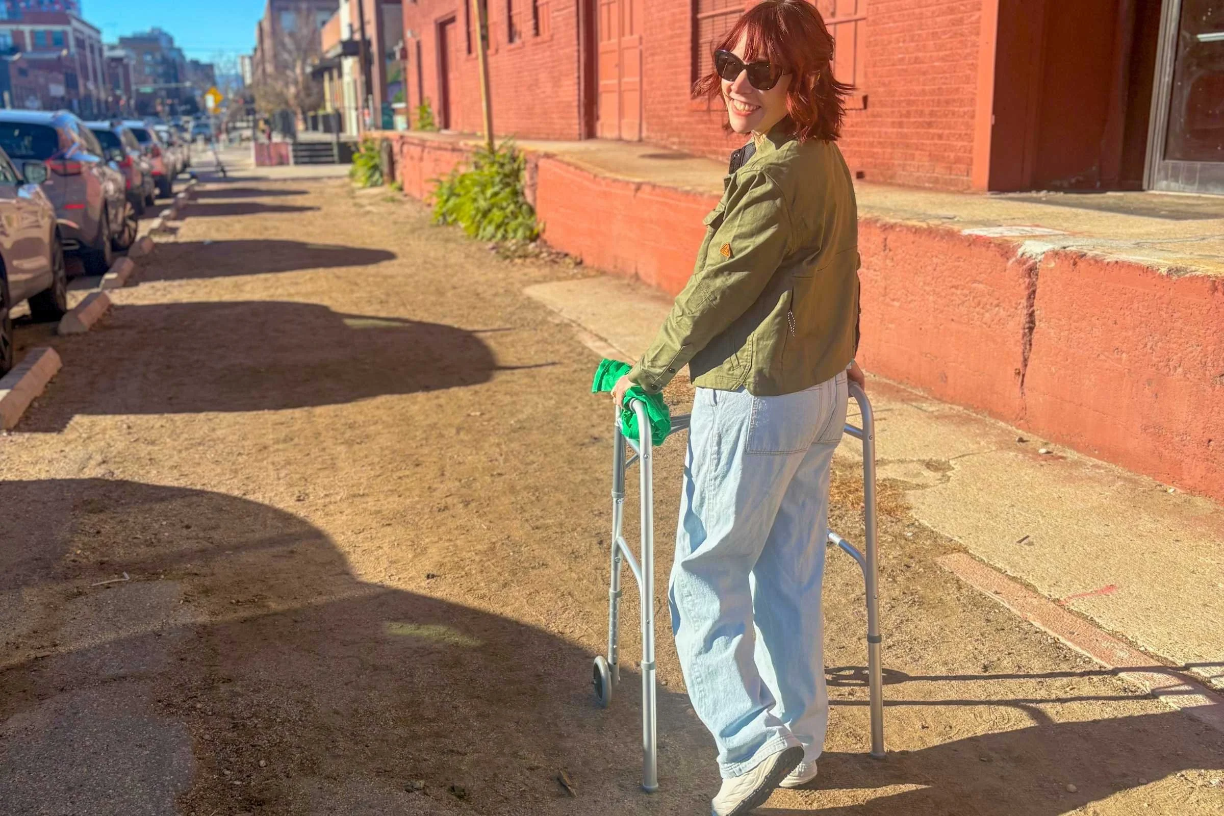 woman walking with a walker outside