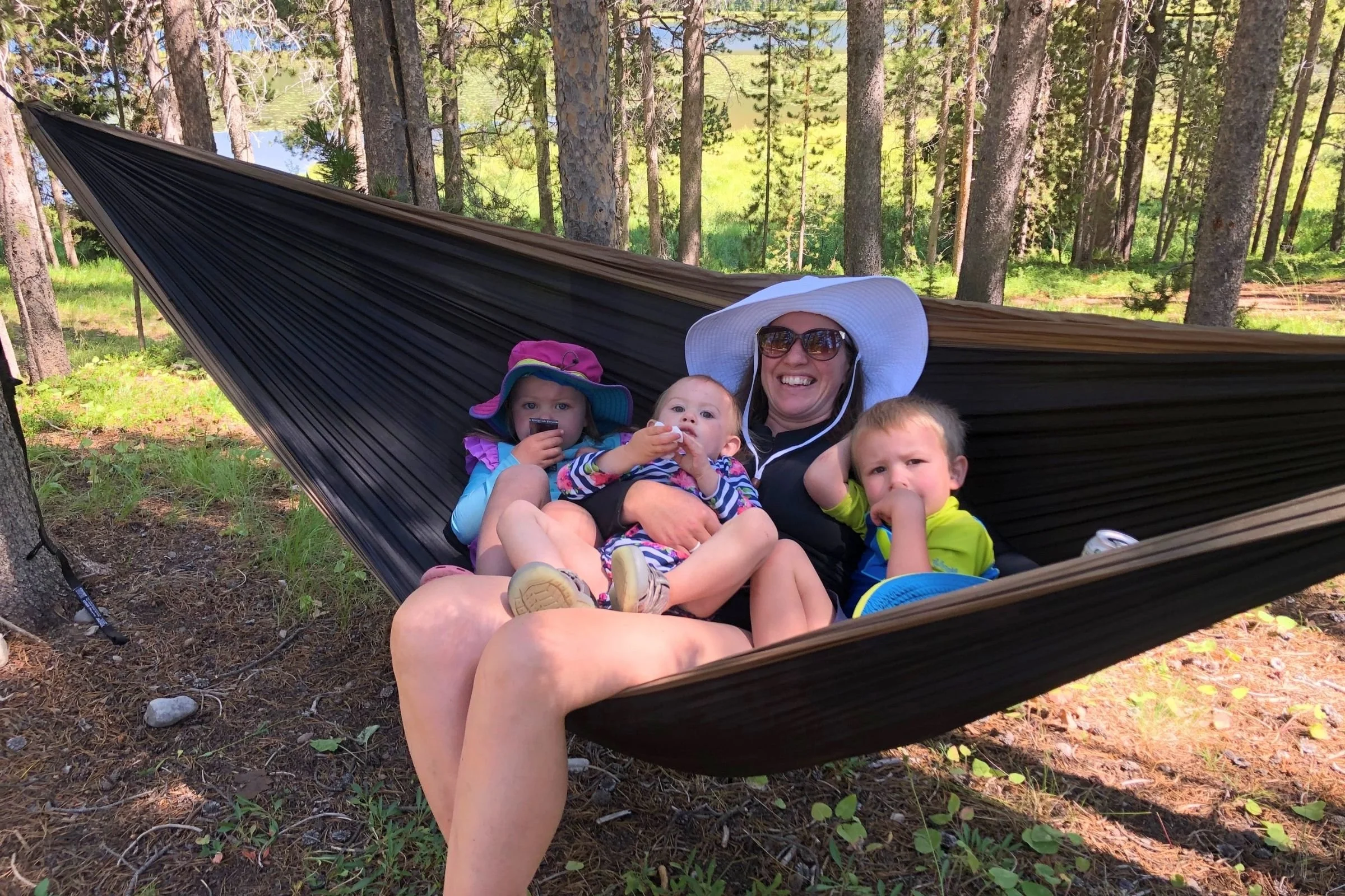 Woman and three toddlers in an ENO DoubleNest Hammock. Photo courtesy Tiffany Searsdodd.