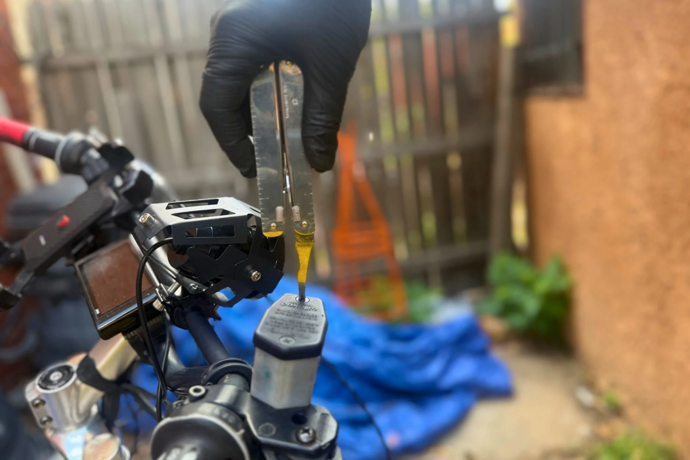 Doing maintenance on a hydraulic disc brake with the Swiss Tool X. Courtesy Chris Meehan