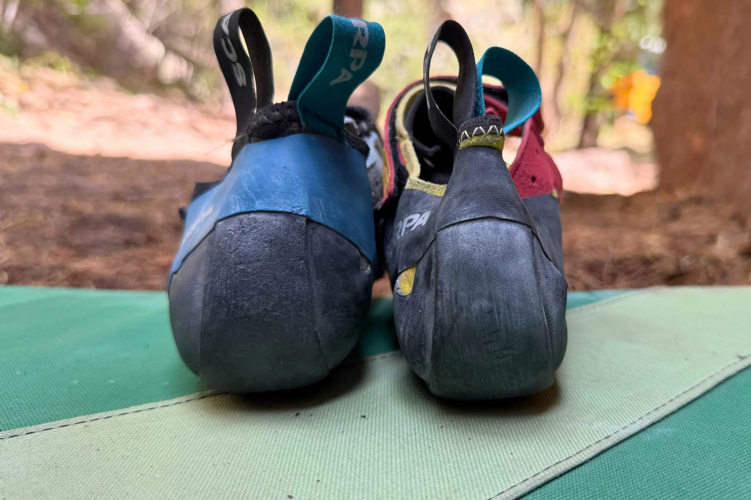 Scarpa Instinct VSR next to Scarpa Drago showcasing their heel cups